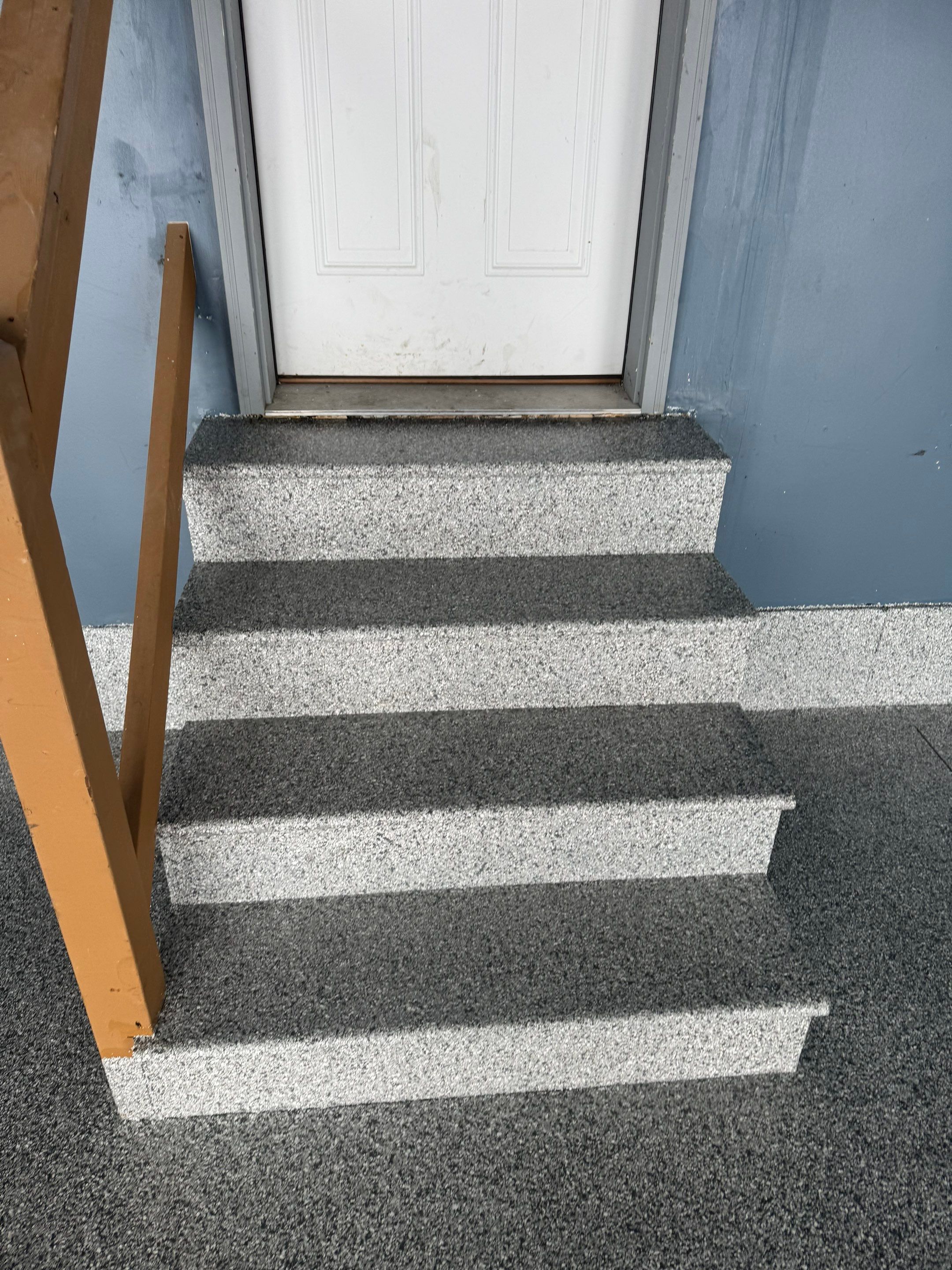 Grey Speckled Epoxy Garage Floor and Stair Coating in Sioux Falls by Select Painting, Coatings & Garage Cabinets