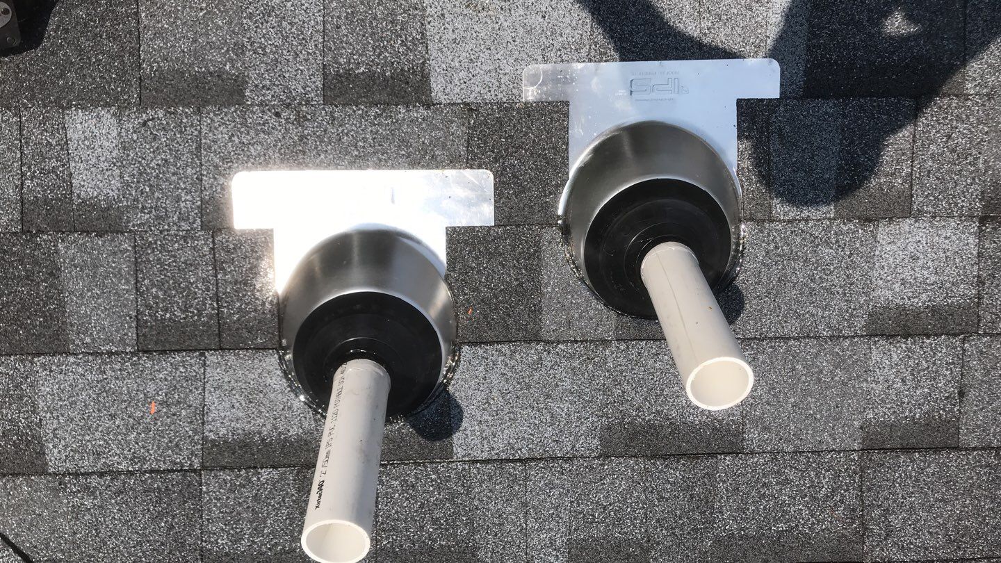 Commercial Roofing Installation using EPDM with white gutters by A Plus Exterior