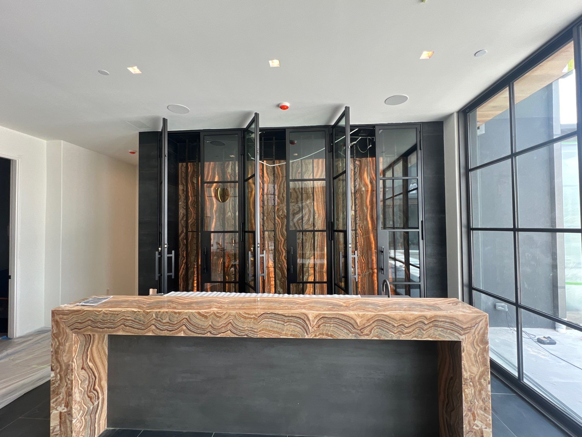 Custom Black-Framed Glass Wine Cellar Installation in Dallas by Solara Custom Living