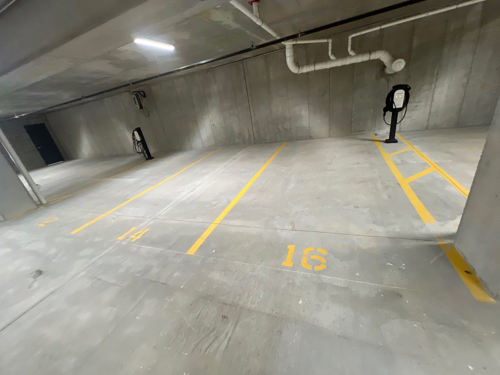 Parking garage using Hot water by Northern Power Washing LLC.