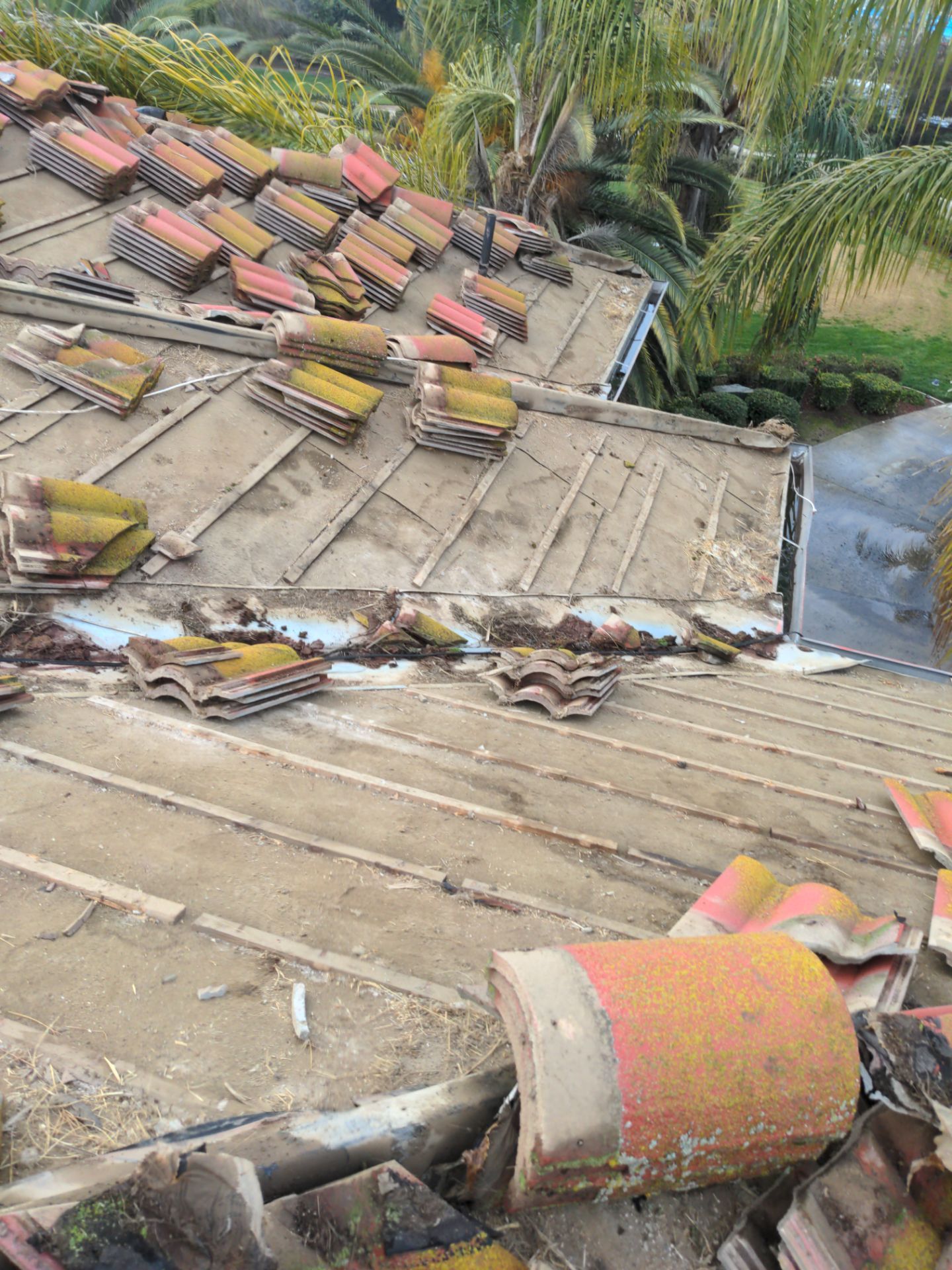 Tile refurbish project using existing tiles and replaced underlayment and battens by Straight Edge Roofing Inc