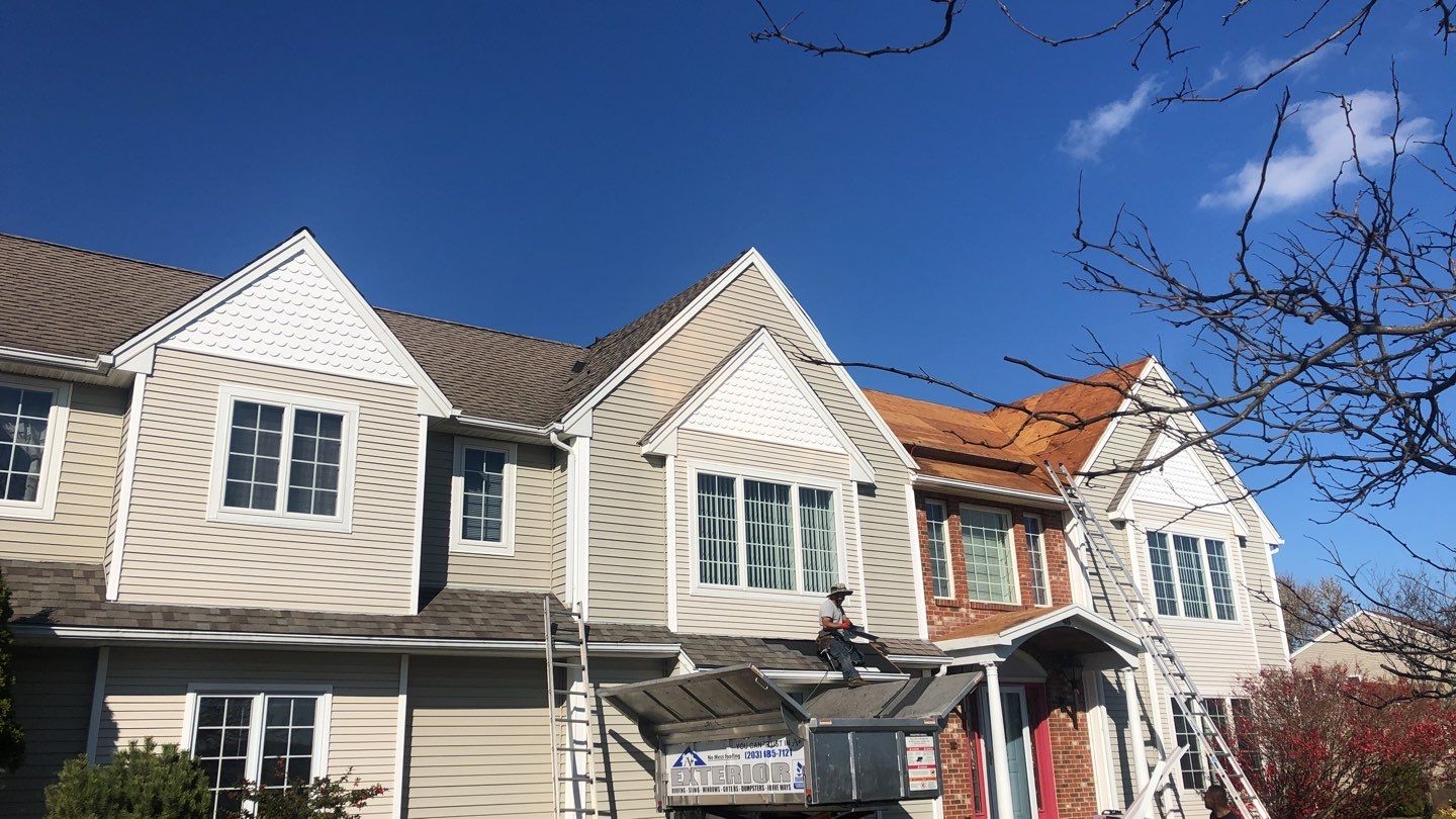 Commercial Roofing Installation using Owens Corning TruDefinition driftwood by A Plus Exterior