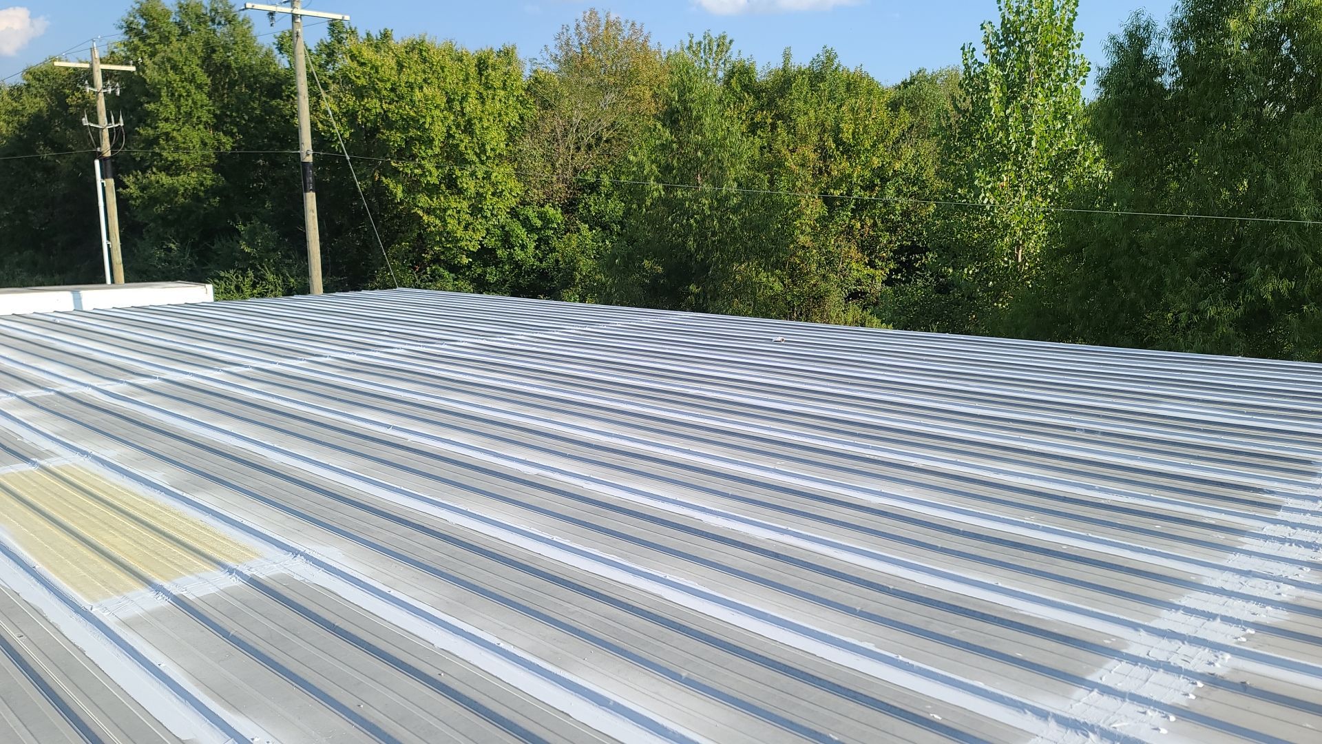 Commercial Metal Restoration System using Aldocoat Coatings by Hostetler Roofing