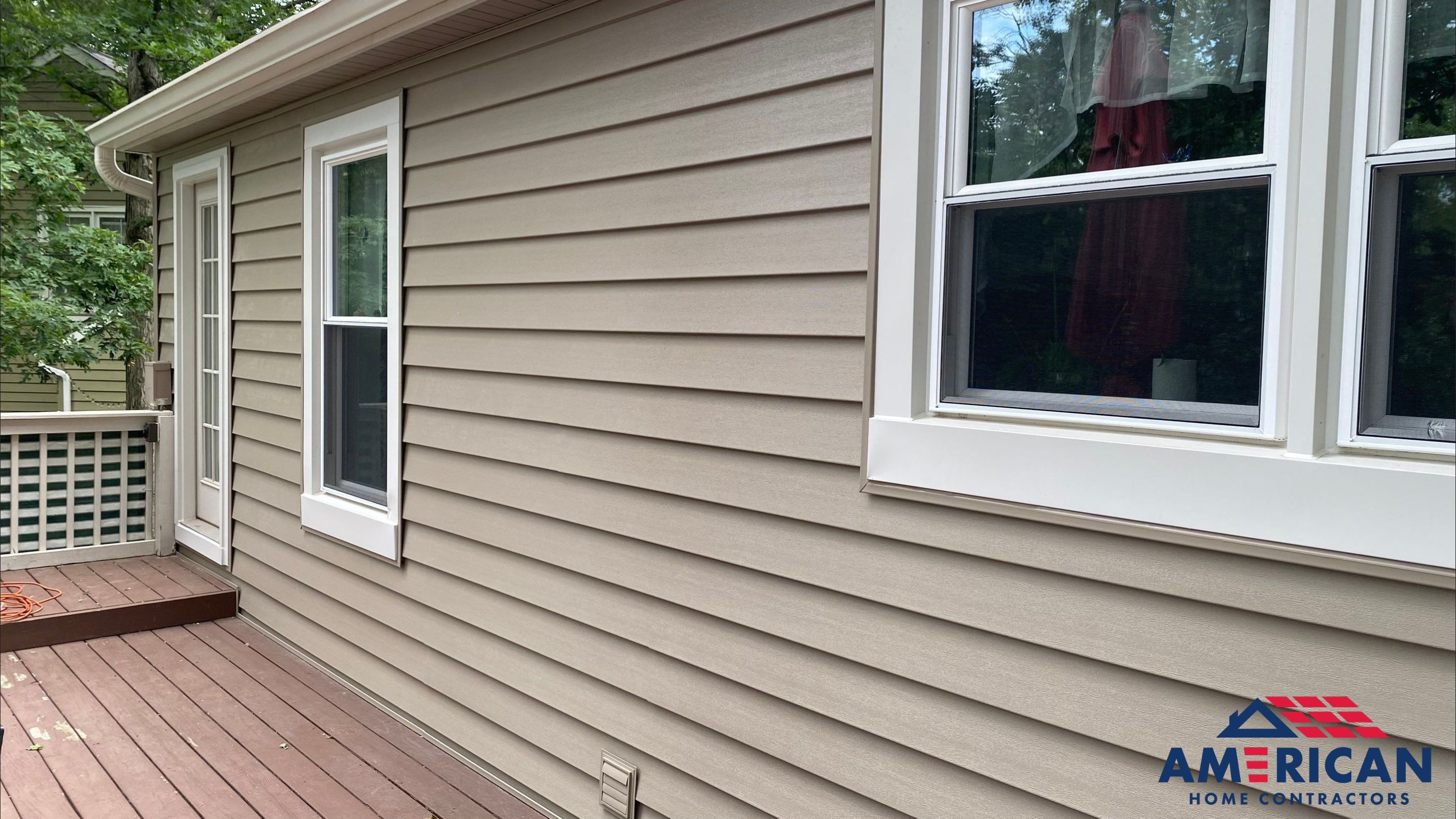 Mastic Siding + Interstate Windows by American Home Contractors