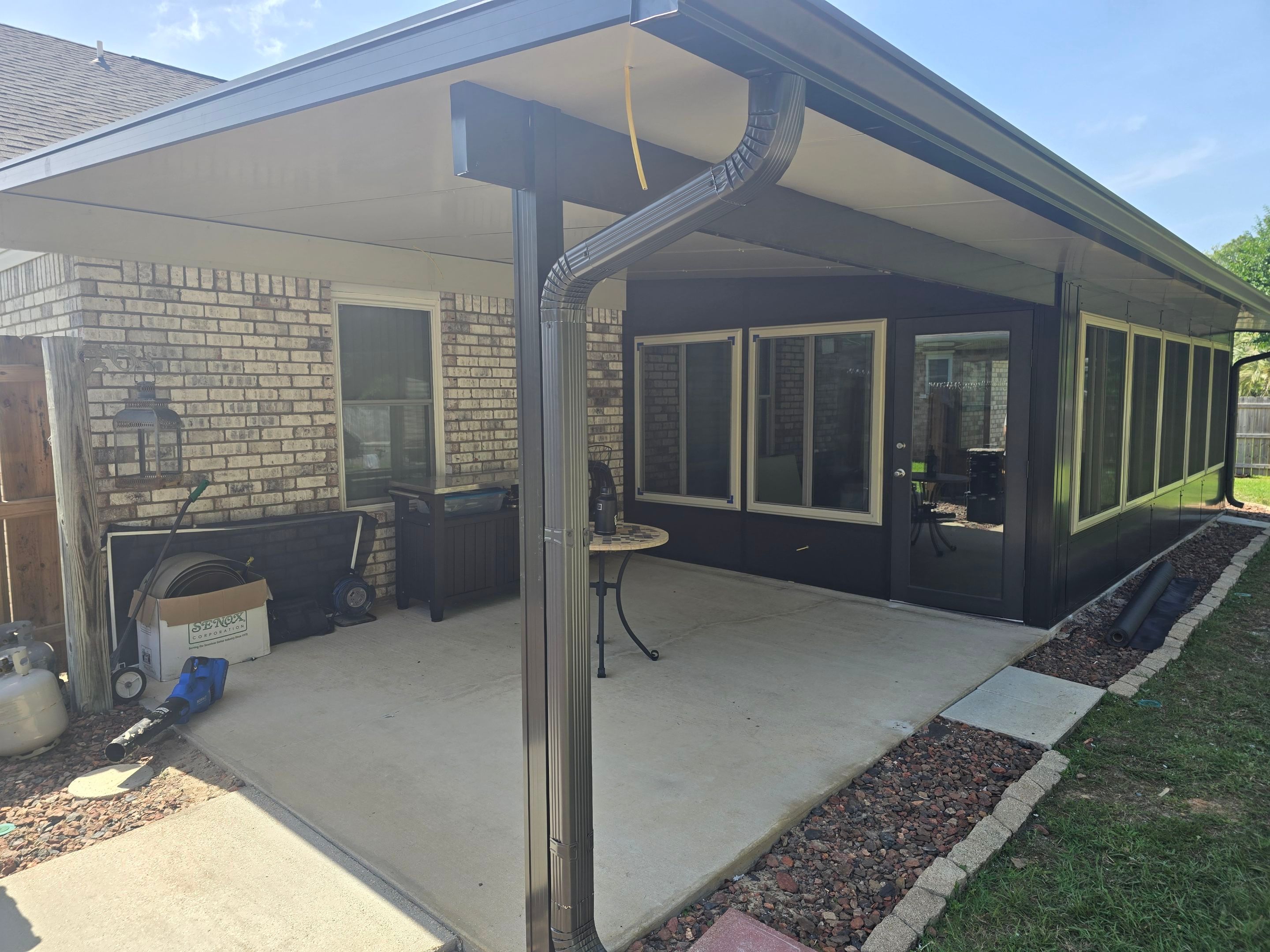 Glass Room & Patio Cover using Colorbeam by Titan Sunrooms