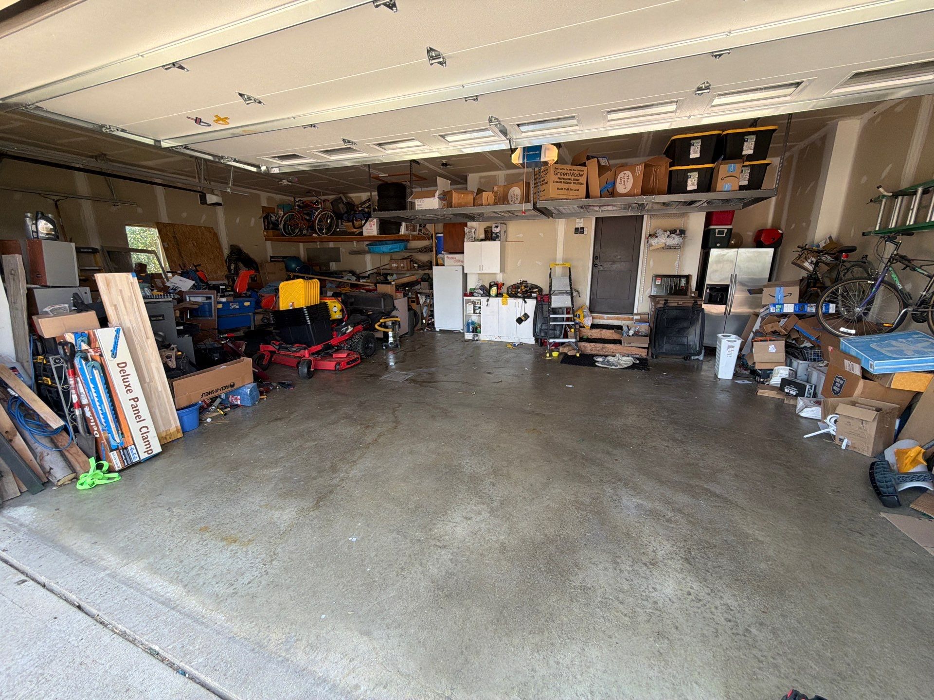 Sioux Falls Garage Concrete Grinding and Nightfall Decorative Chip Coating by Select Painting, Coatings & Garage Cabinets