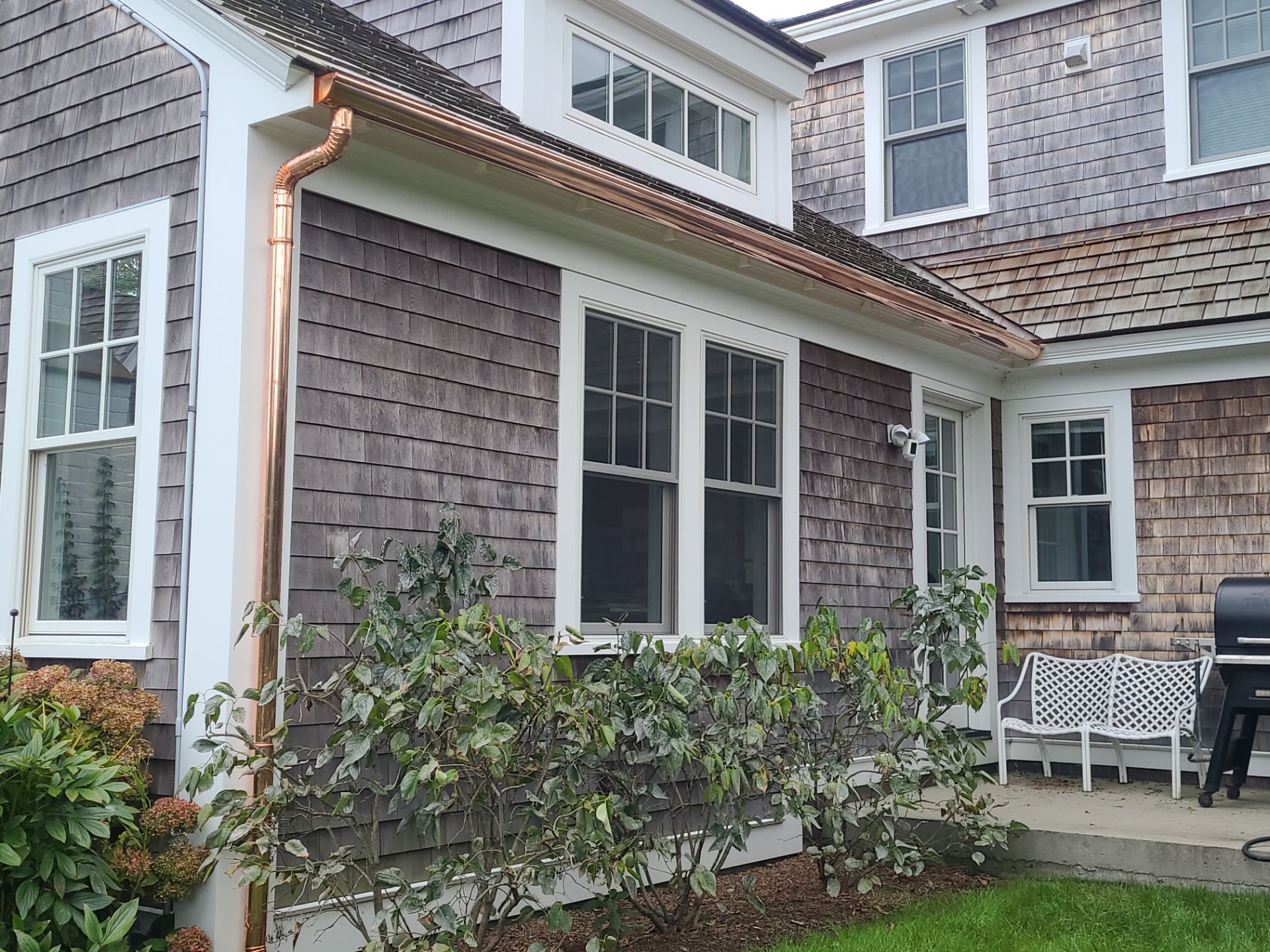 Gutter Installation using 6" Half Round Copper Gutter and Vinyl wedge buildout by Gutter Pro Enterprises
