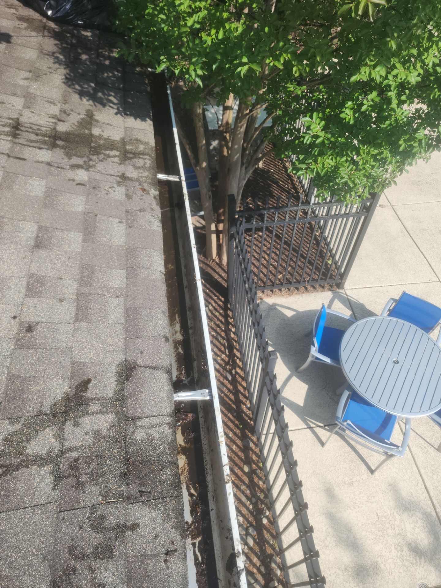 HOA gutter cleaning in Winchester, VA, after  photo showing full gutters.