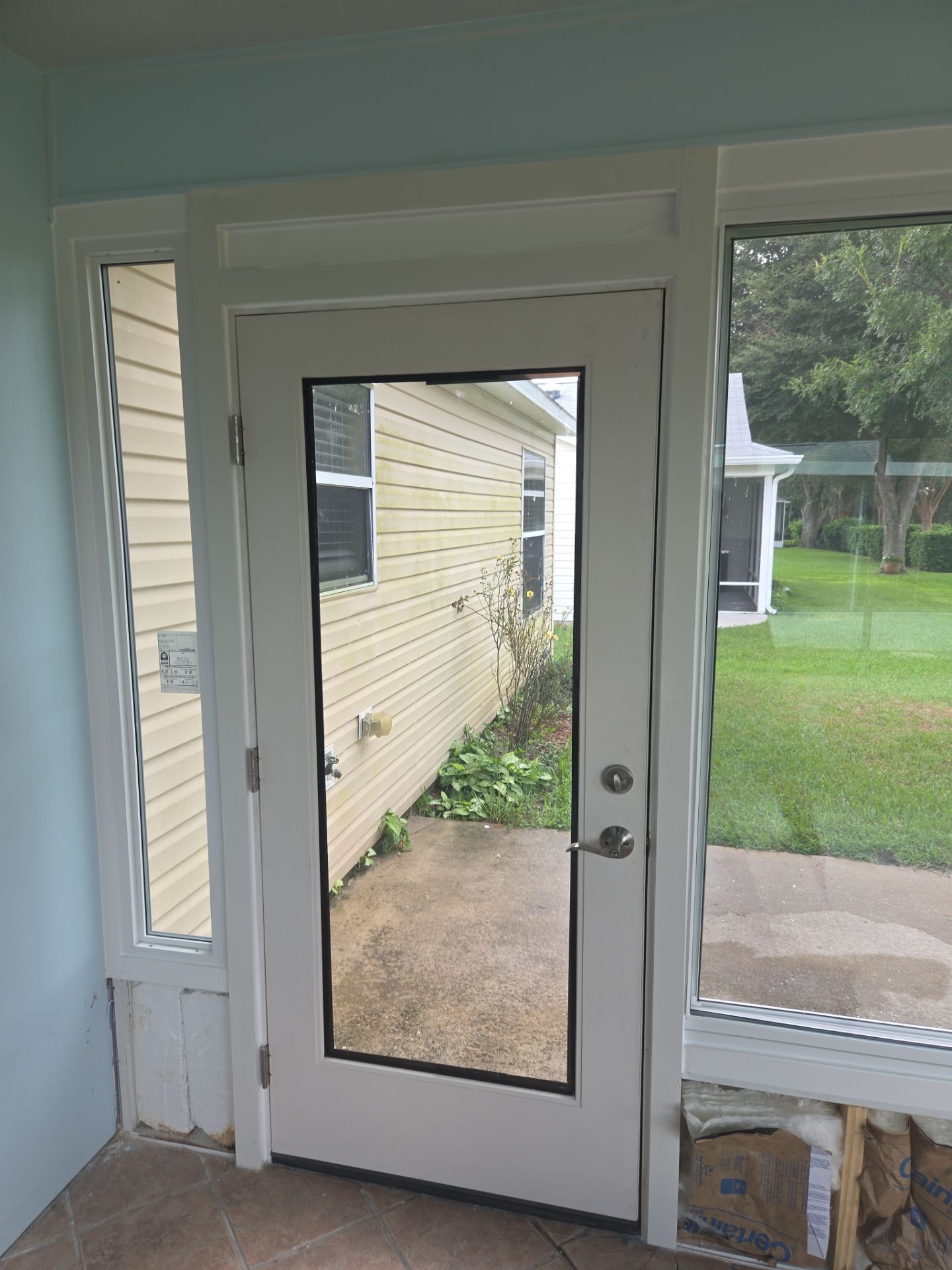 Sunroom Conversion with Alside Windows and Provia Door in The Villages by Windows & Doors Store