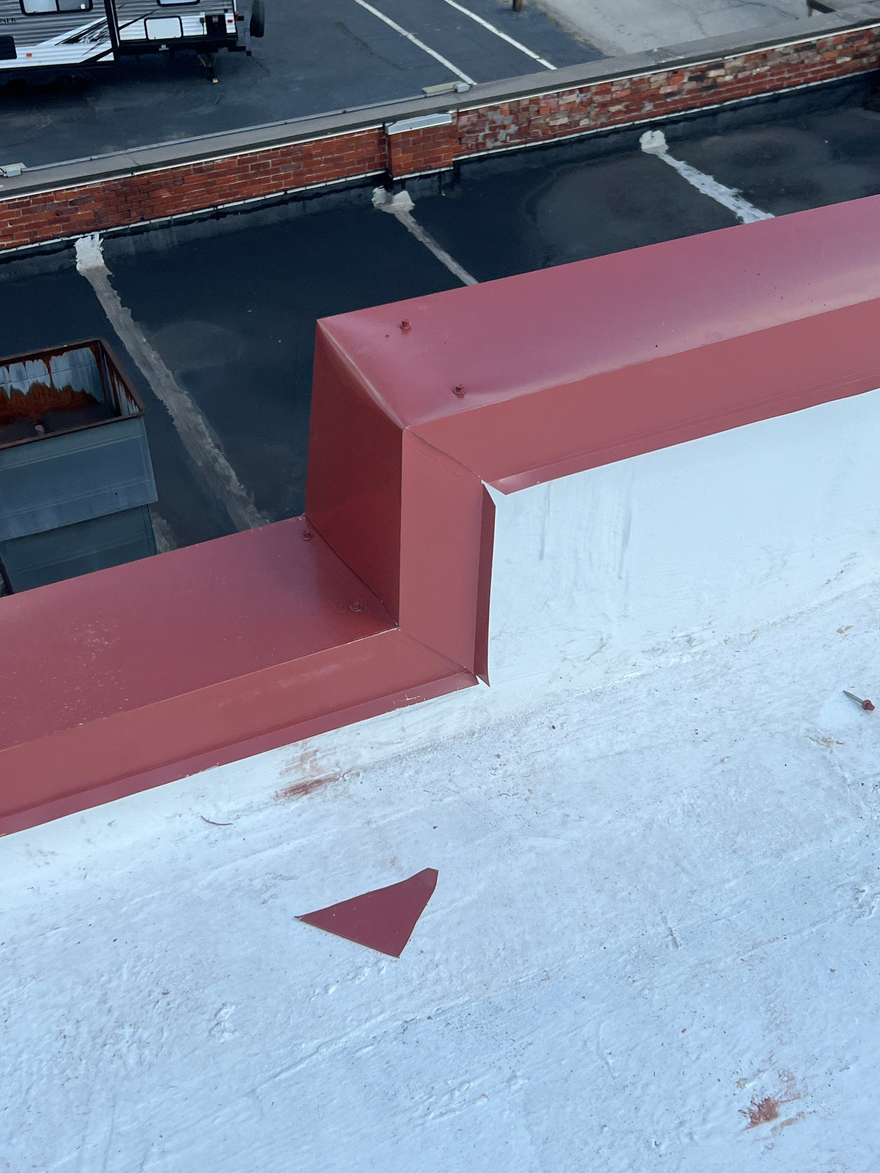 Commercial Roofing Installation using smartcoat Roof coating by Fahey Roofing + Contracting