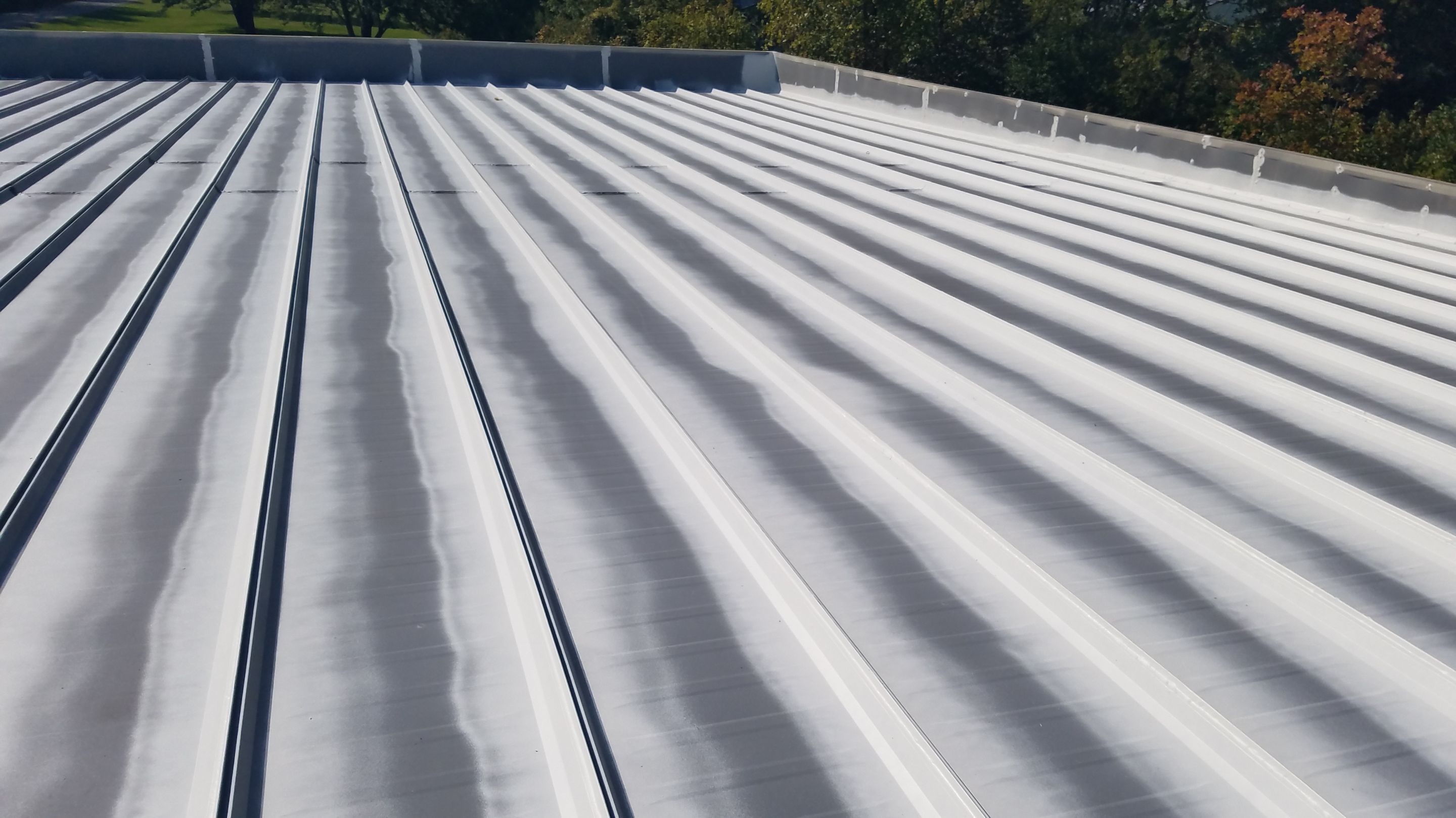 Commercial Metal Roof Coating by Gold Star Roofing LLC