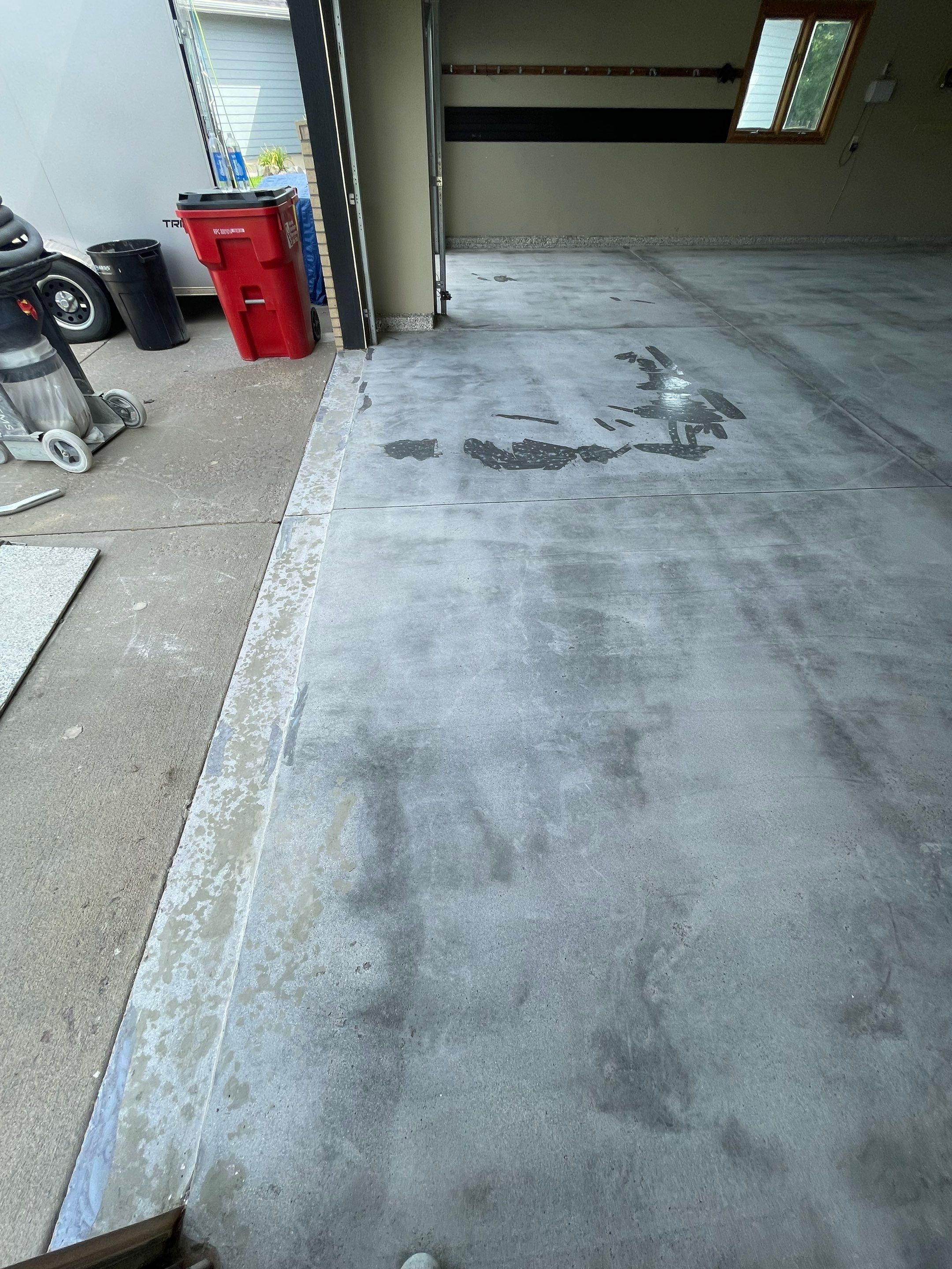 Cabin FEver Flake Garage Floor Coating Installation in Sioux Falls by Select Painting, Coatings & Garage Cabinets