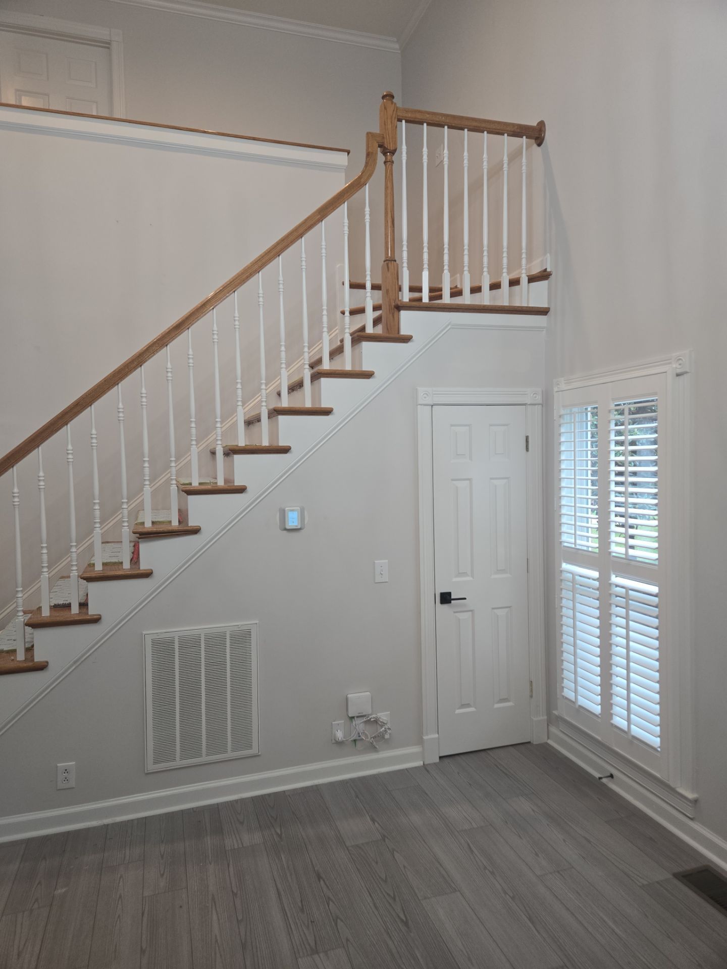 Updated staircase and hallway by Footprints Floors of Nashville