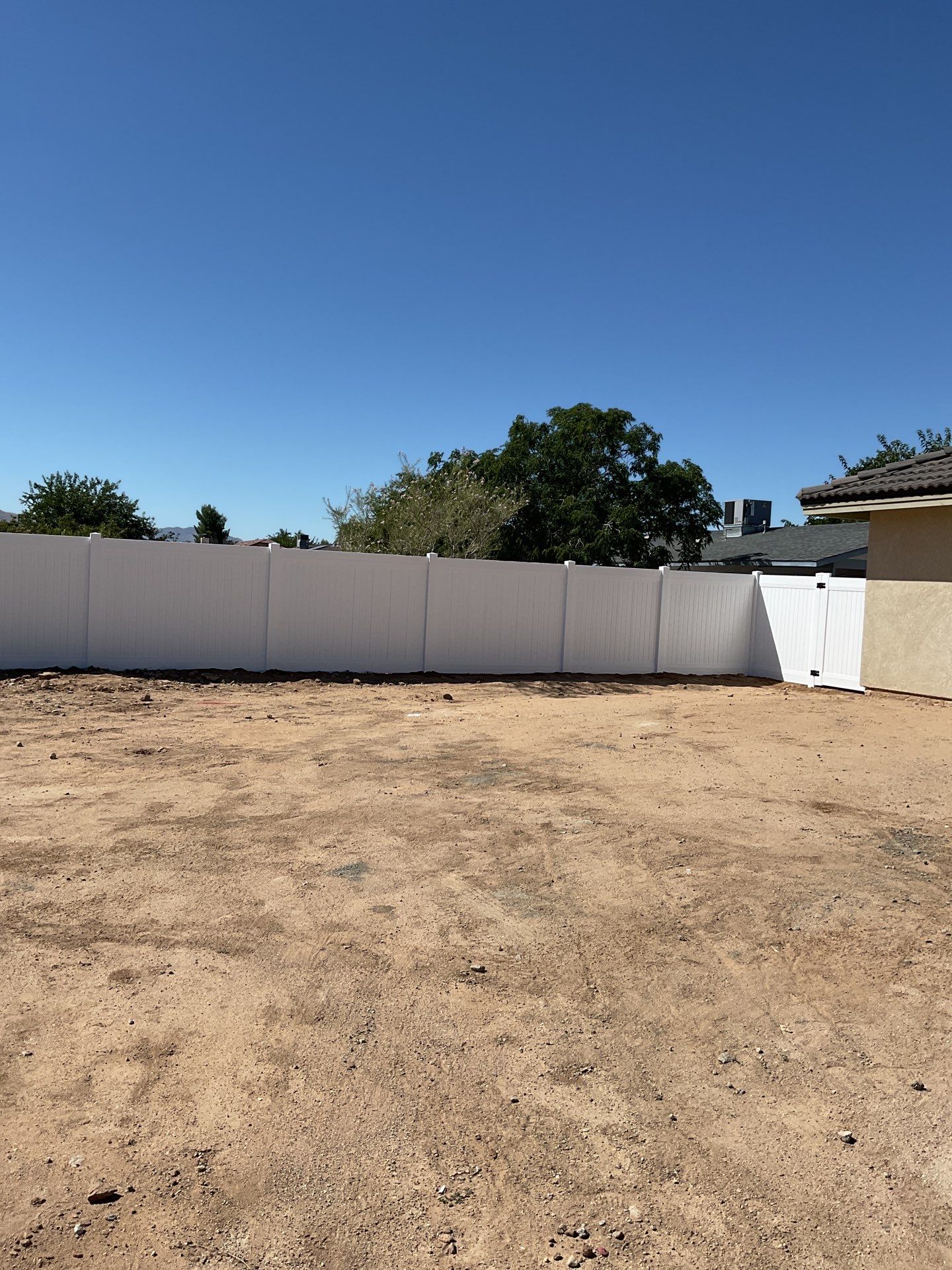 6ft White Privacy Vinyl Fence with Chain-link Fence by Fence Guys Inc.
