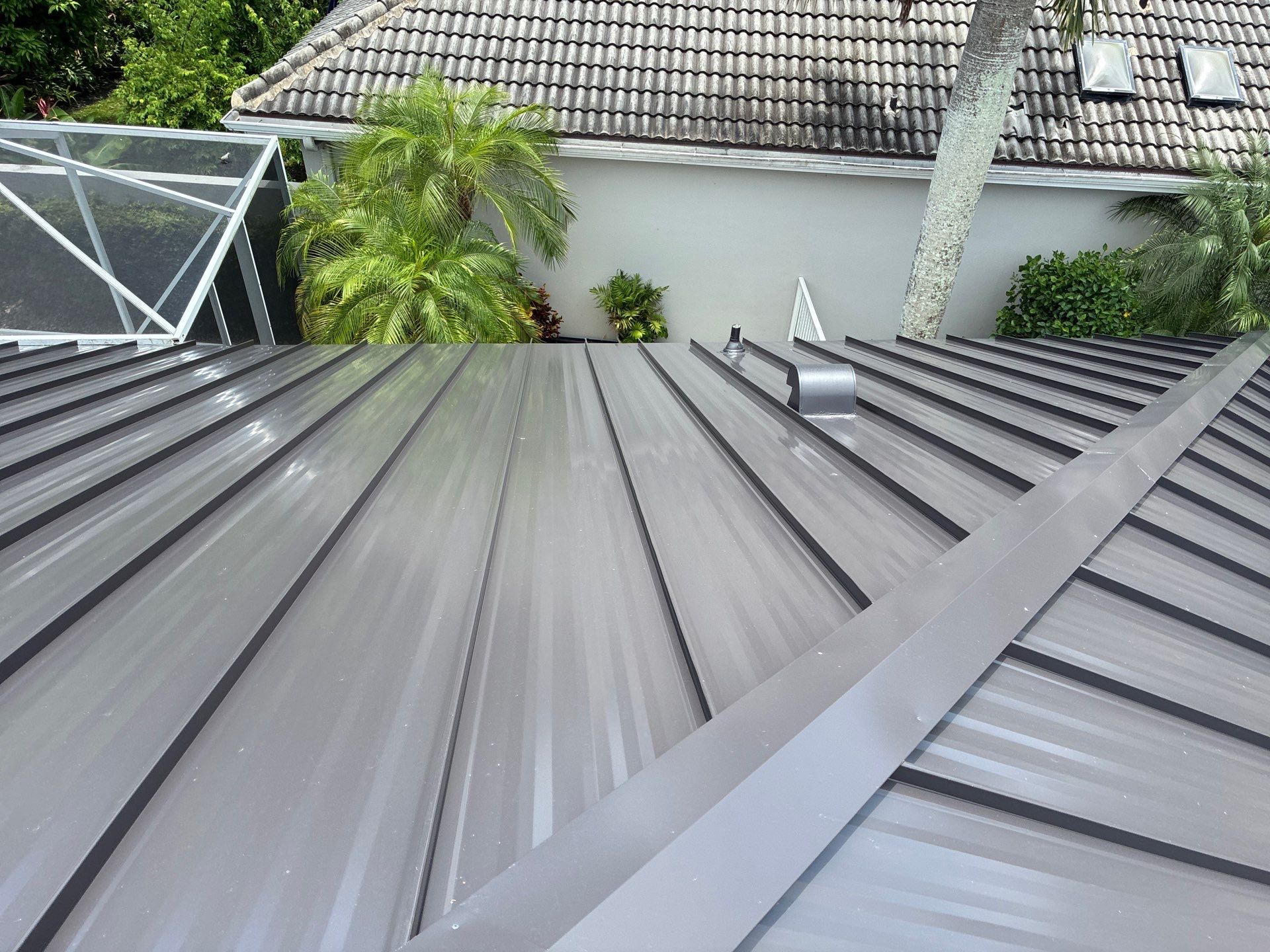 24ga 1.5" Mechanical Seam Dark Bronze by Total Roofing System The Metal Roof Experts