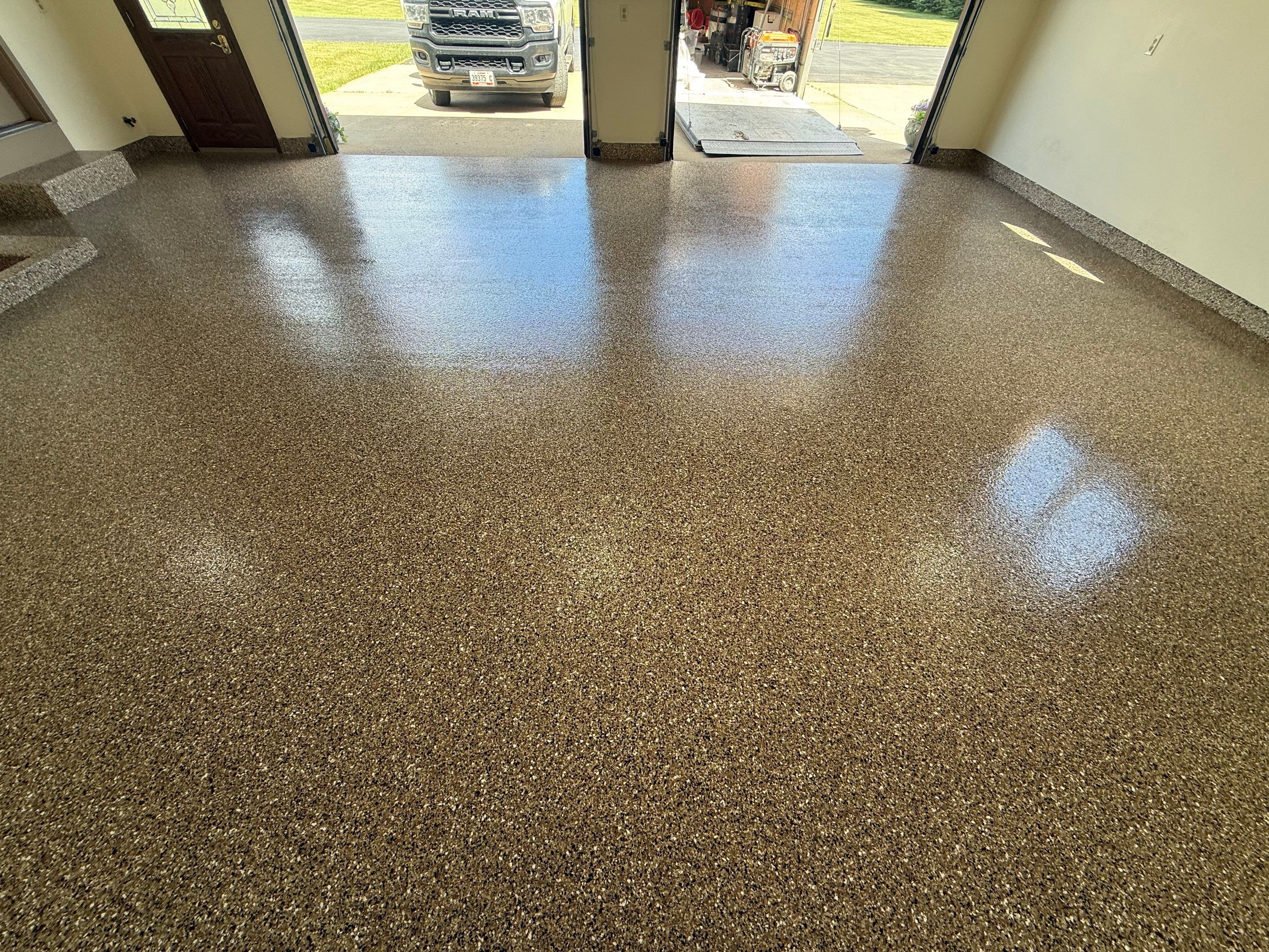 Custom Polyaspartic Garage Floor and Stairwell Coating in Pipestone by Select Painting, Coatings & Garage Cabinets