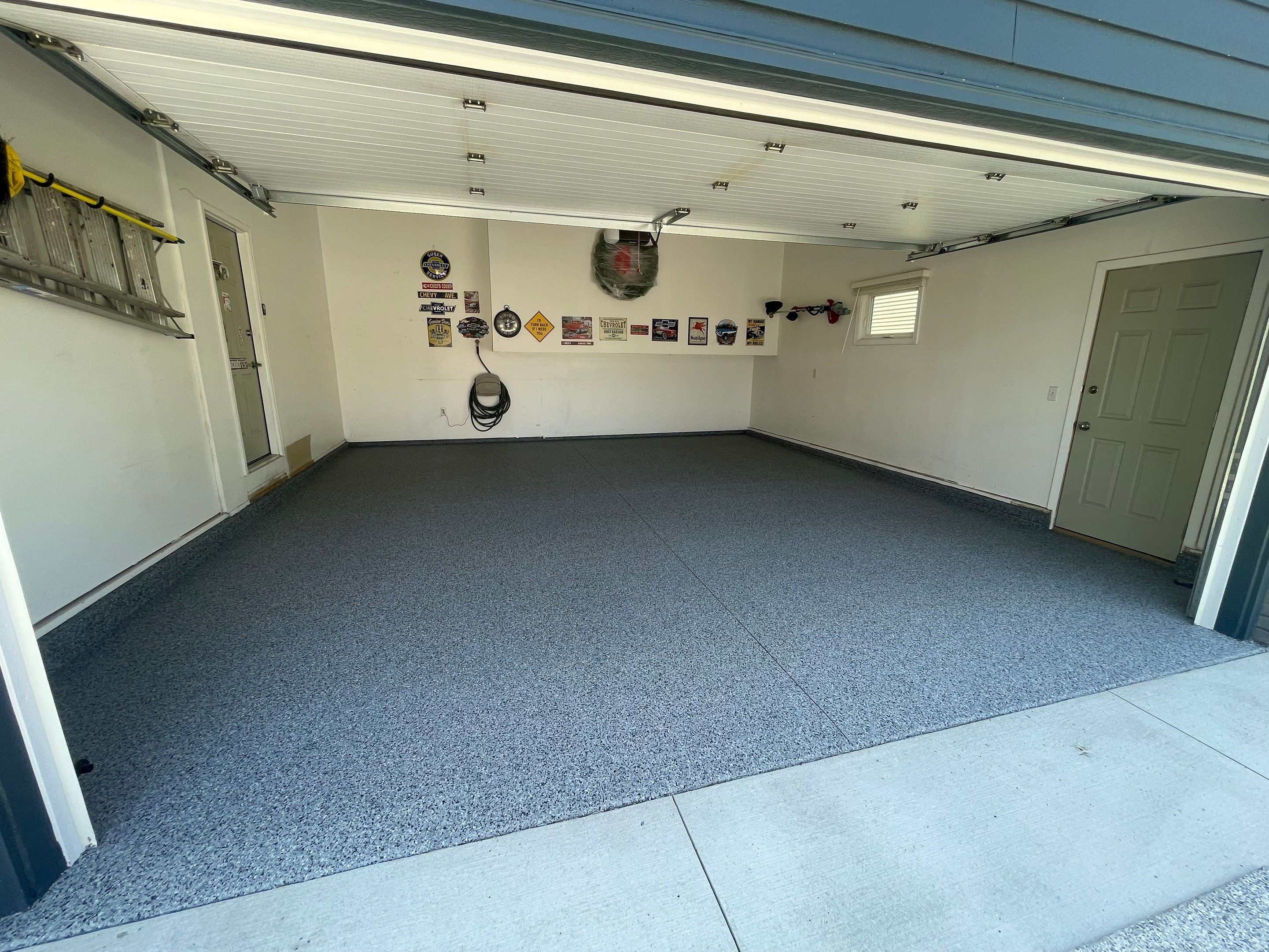 Sioux Falls Garage Floor Coating with Nightfall Decorative Chips by Select Painting, Coatings & Garage Cabinets