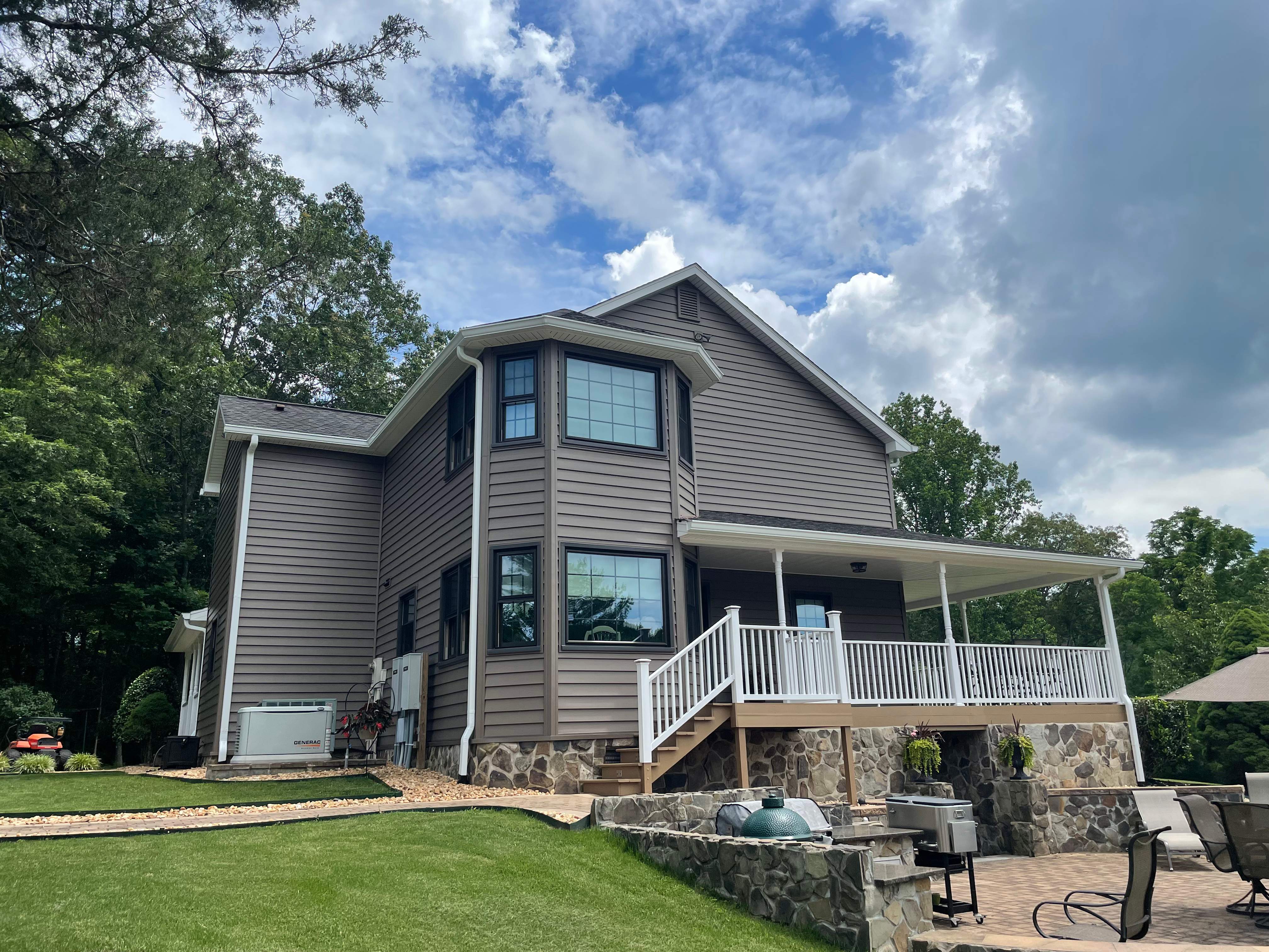 Exterior remodel including window replacement by American Home Contractors