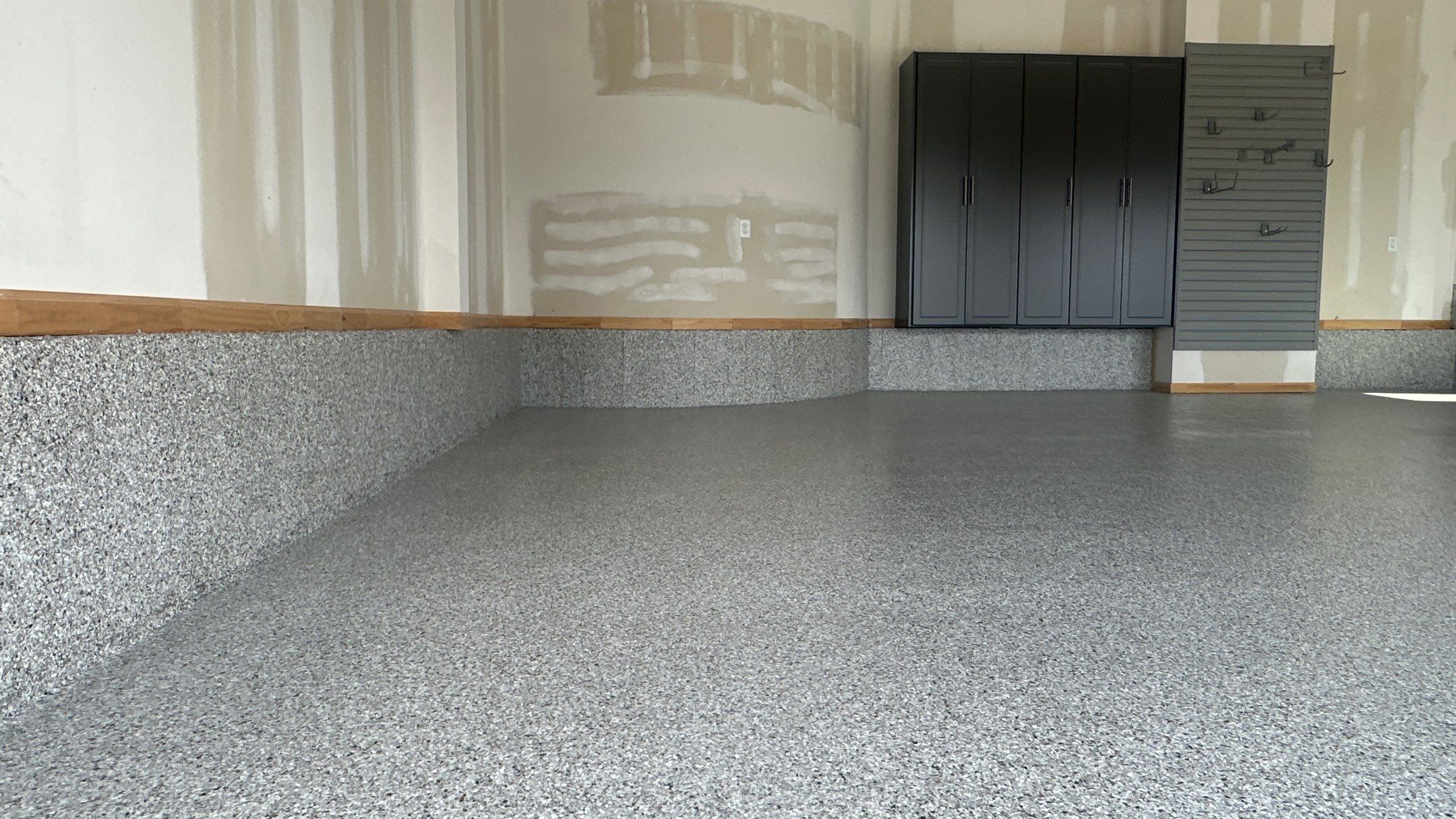 Megan J. added cabinets and slotwall to her garage. Plus a New Floor by Banner Garage