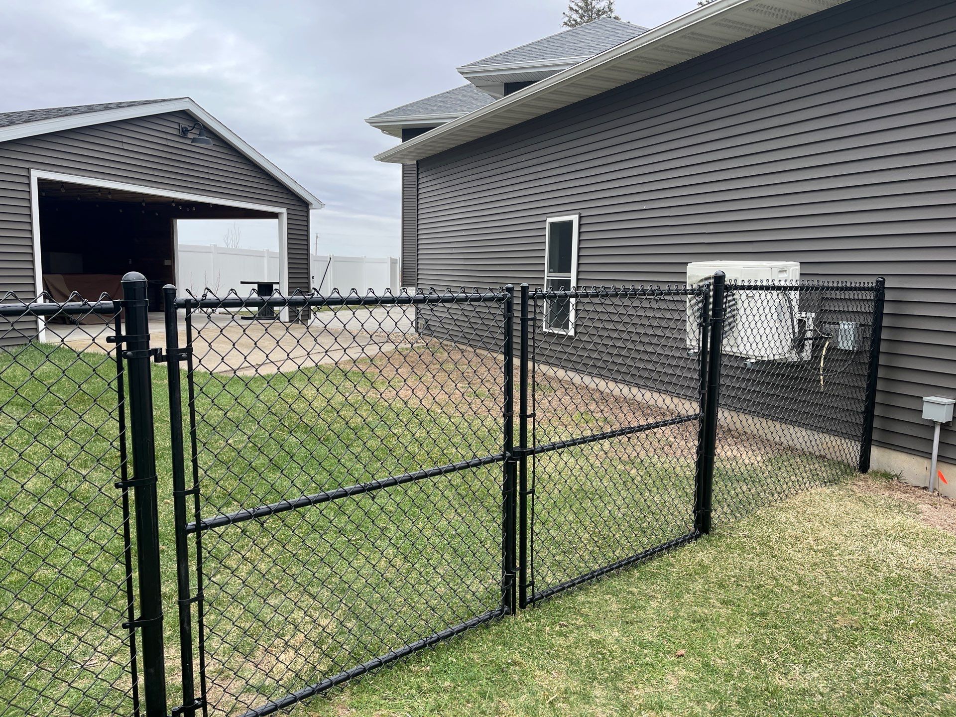 White Vinyl Privacy and Black Chain Link Fencing in Buckingham by Perfect Picket Fence and Stain