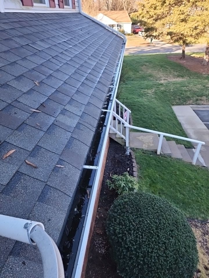 Gutter Cleaning using water by Power Wash Masters LLC