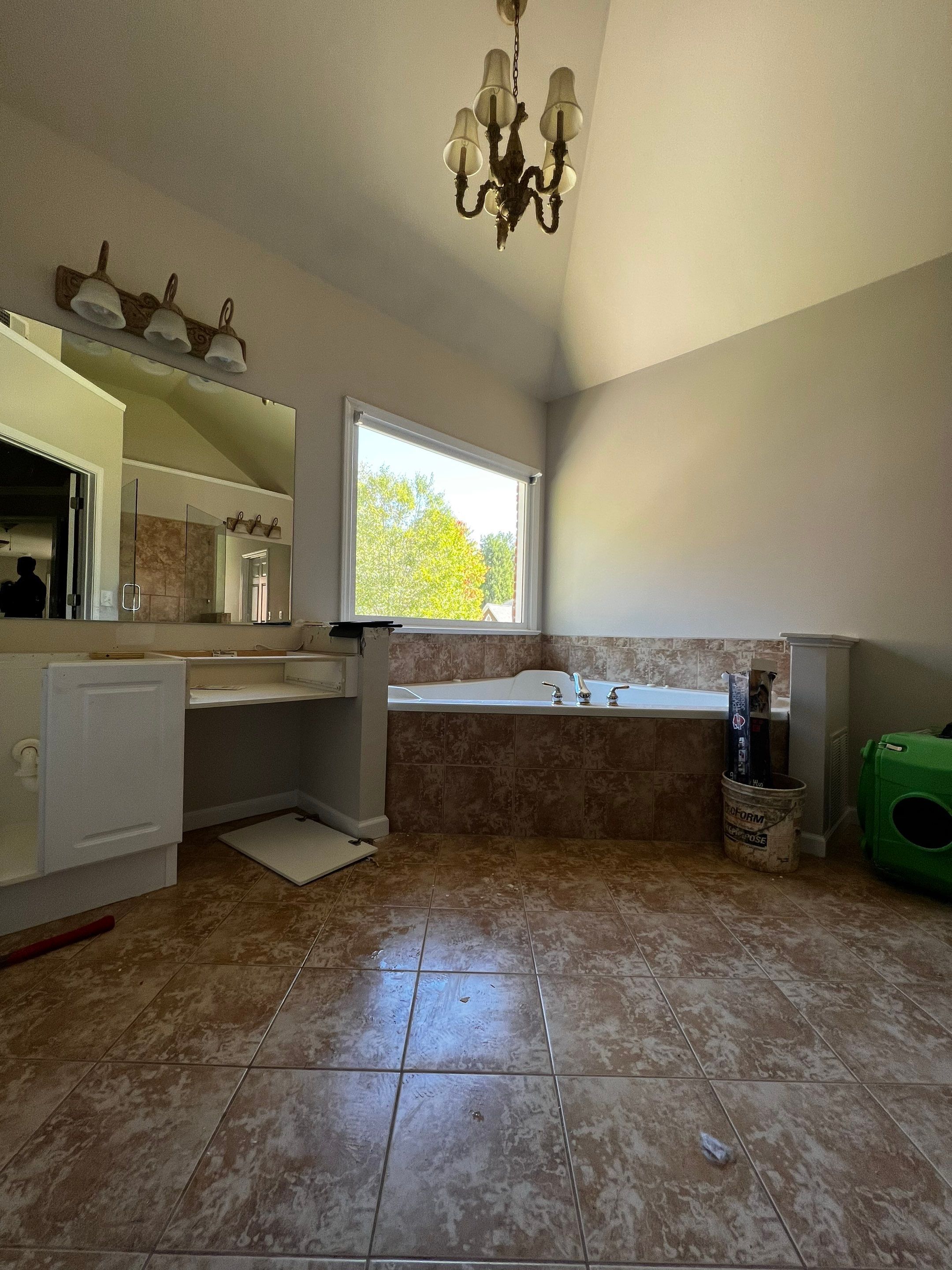 Master Bathroom Renovation with Marble Floor and Freestanding Soaking Tub by Swift Home Renovations