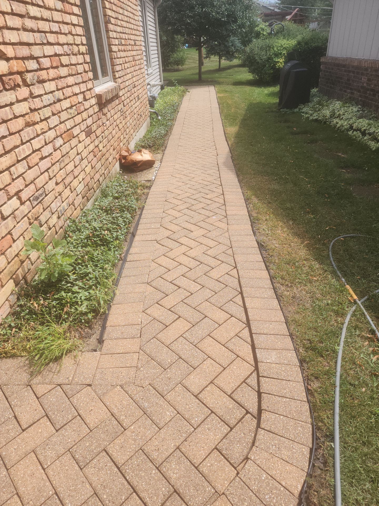 Arlington Heights Brick paver repair, cleaning and sealing by Northern Power Washing LLC.