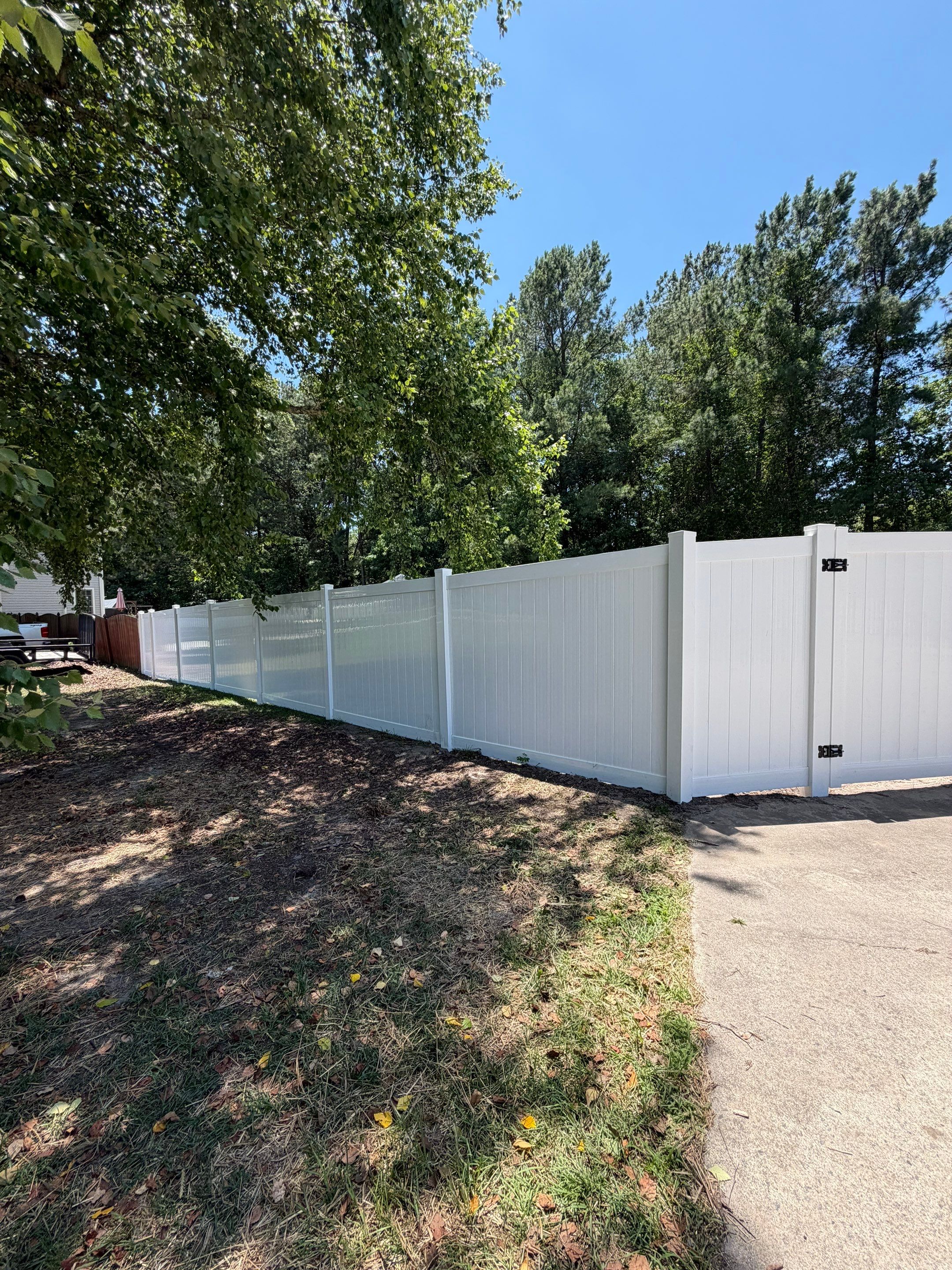 White Vinyl Privacy Fence Replacement with Double Gates in Greenville by Superior Fence and Rail