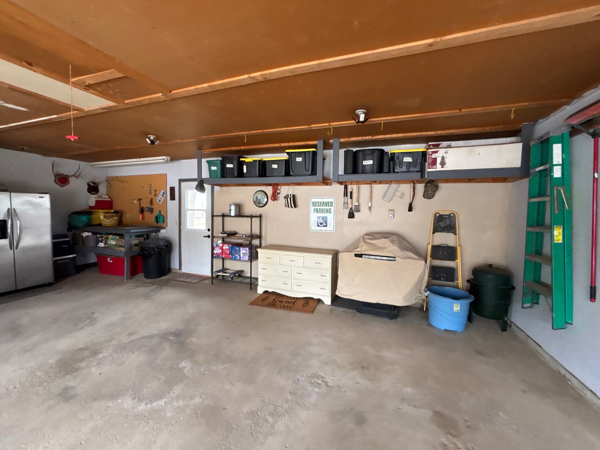 Full-Flake Epoxy Garage Floor Coating Installation in Sioux Falls by Select Painting, Coatings & Garage Cabinets