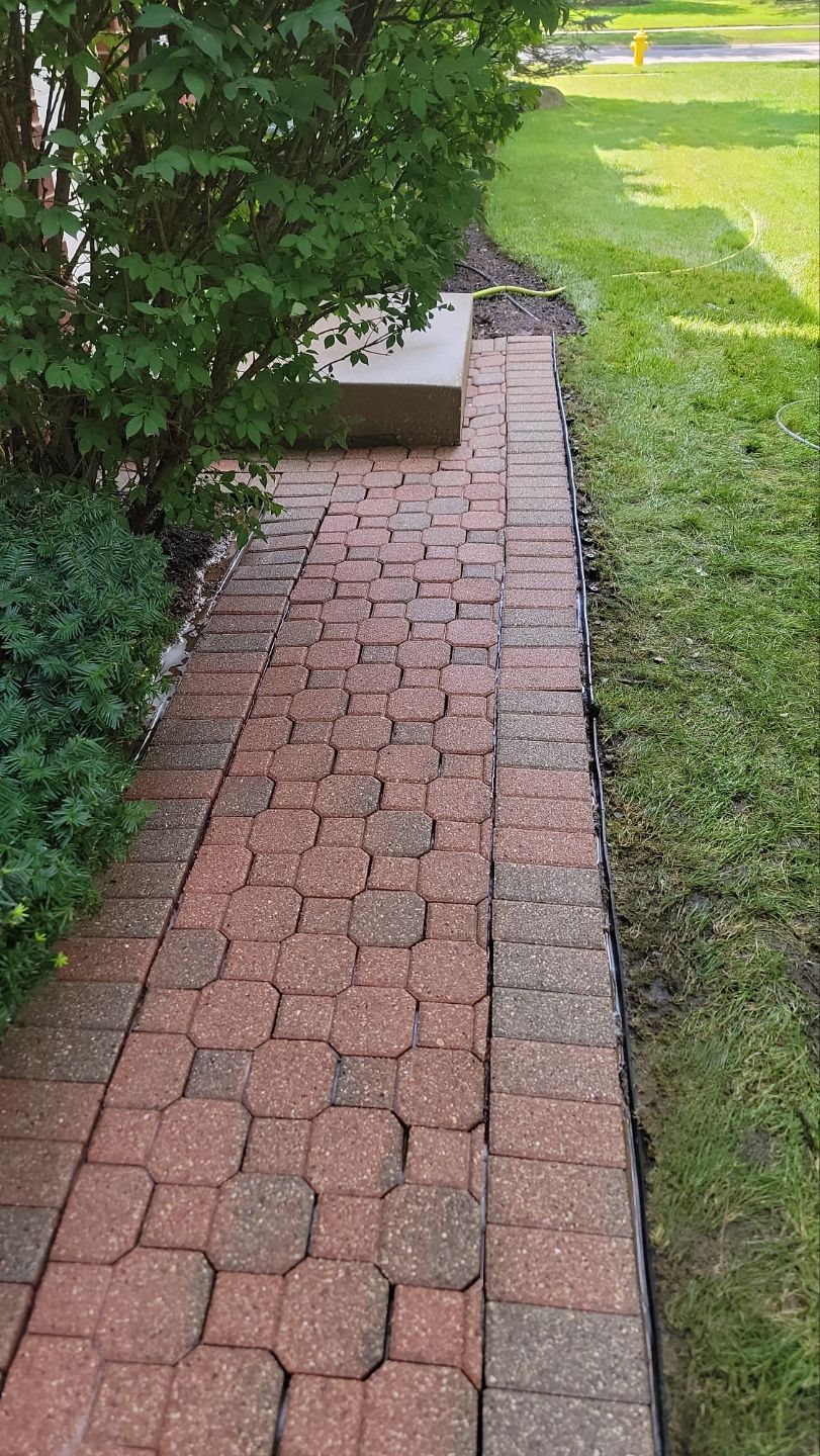 Brick paver repair, clean and seal by Northern Power Washing LLC.