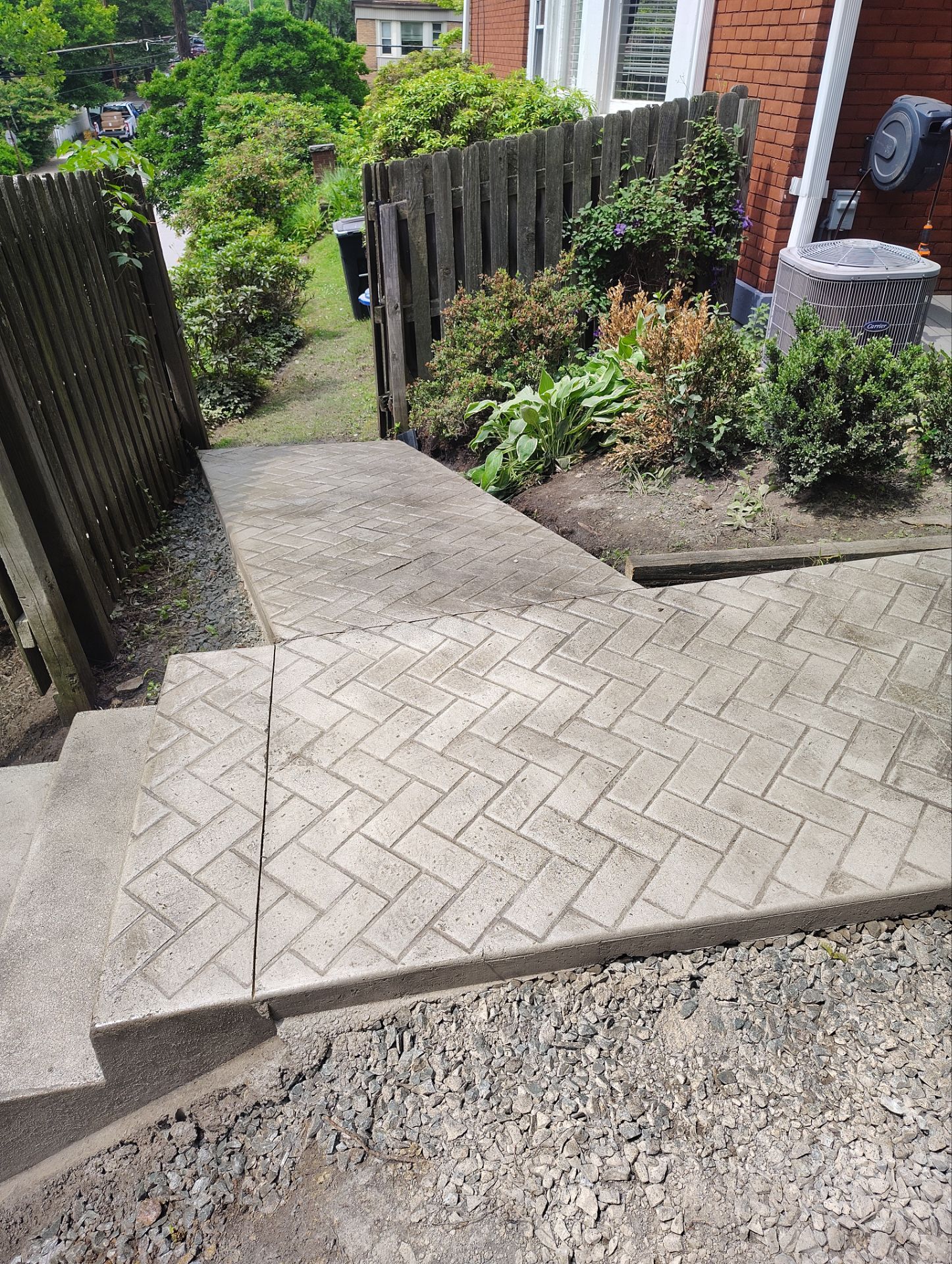 Stamped Concrete and Retaining Wall by Cousins Roofing Siding & Decks