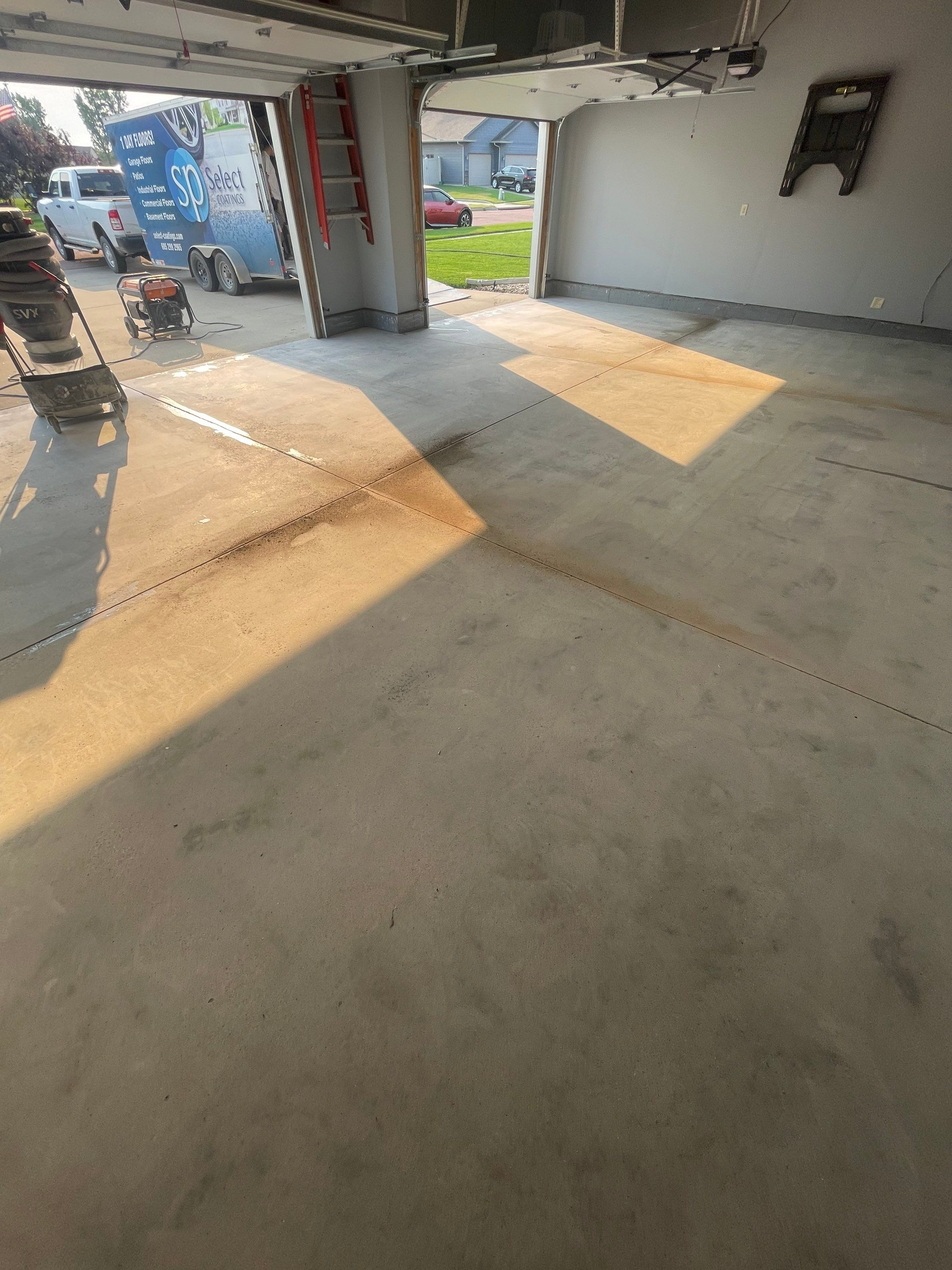 Sioux Falls Garage Concrete Coating Installation with Domino Flake by Select Painting, Coatings & Garage Cabinets