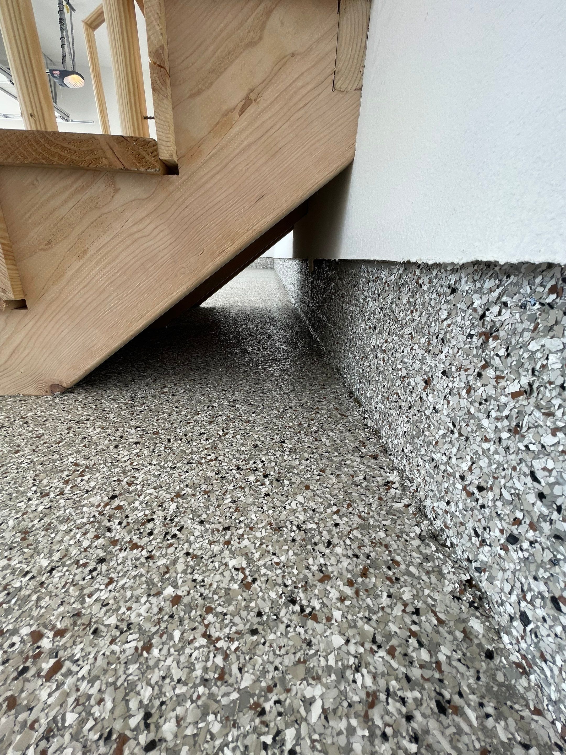 Grey Speckled Garage Floor Coating in Sioux Falls by Select Painting, Coatings & Garage Cabinets