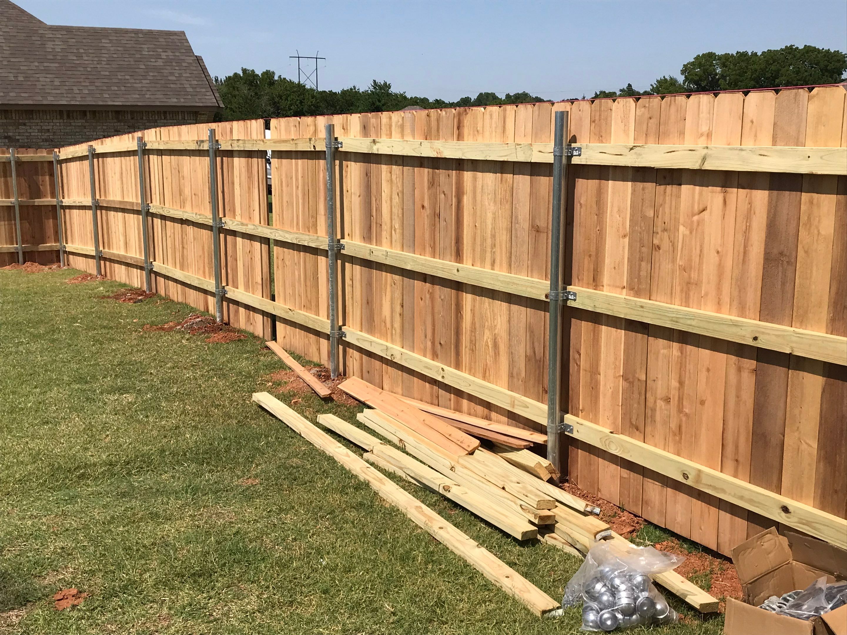 Cedar Fence using Metal Poles by Clays Services Inc