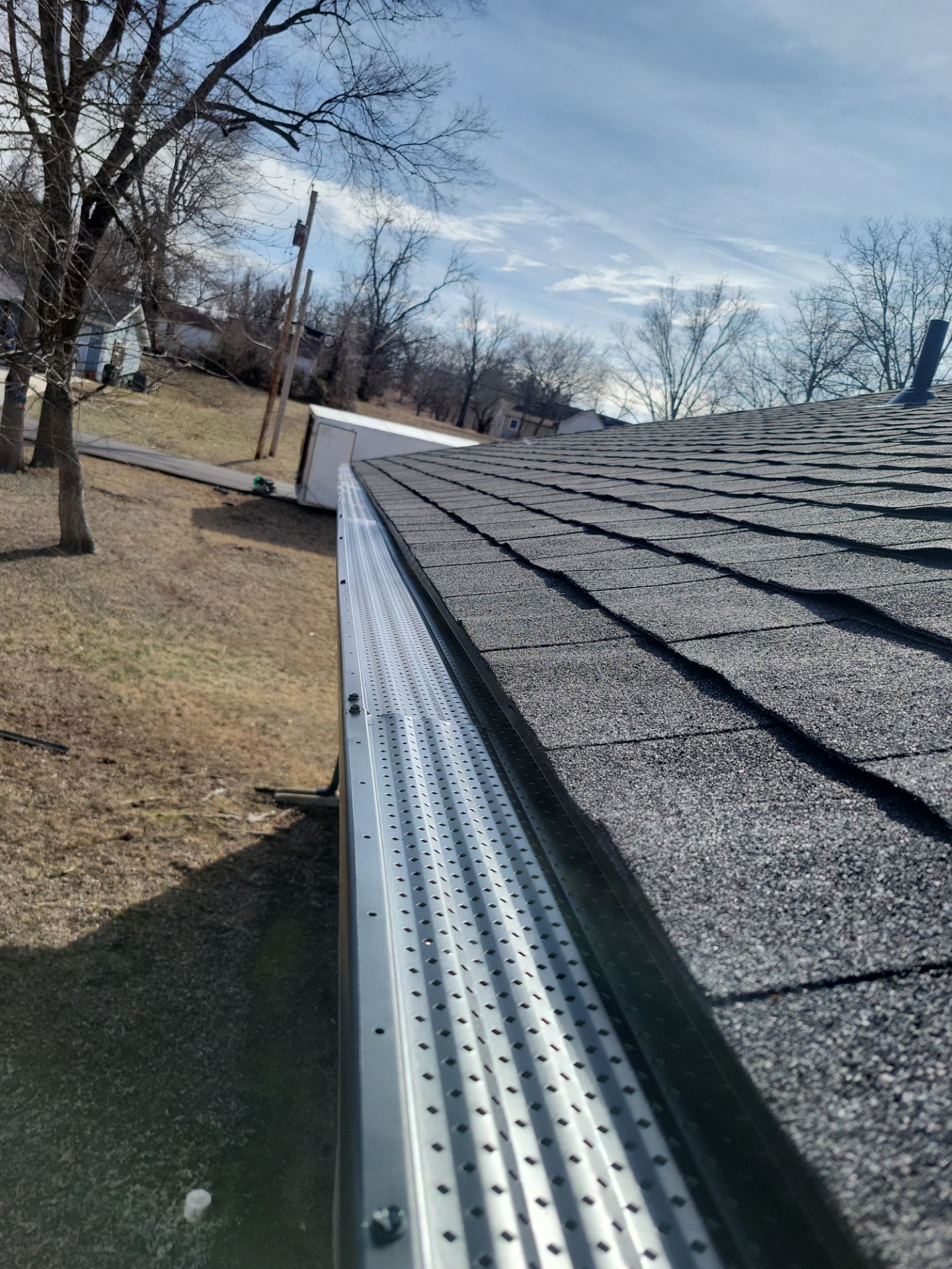 Residential Roofing & Gutter Covers Install  by Titan Commercial & Residential Roofing 