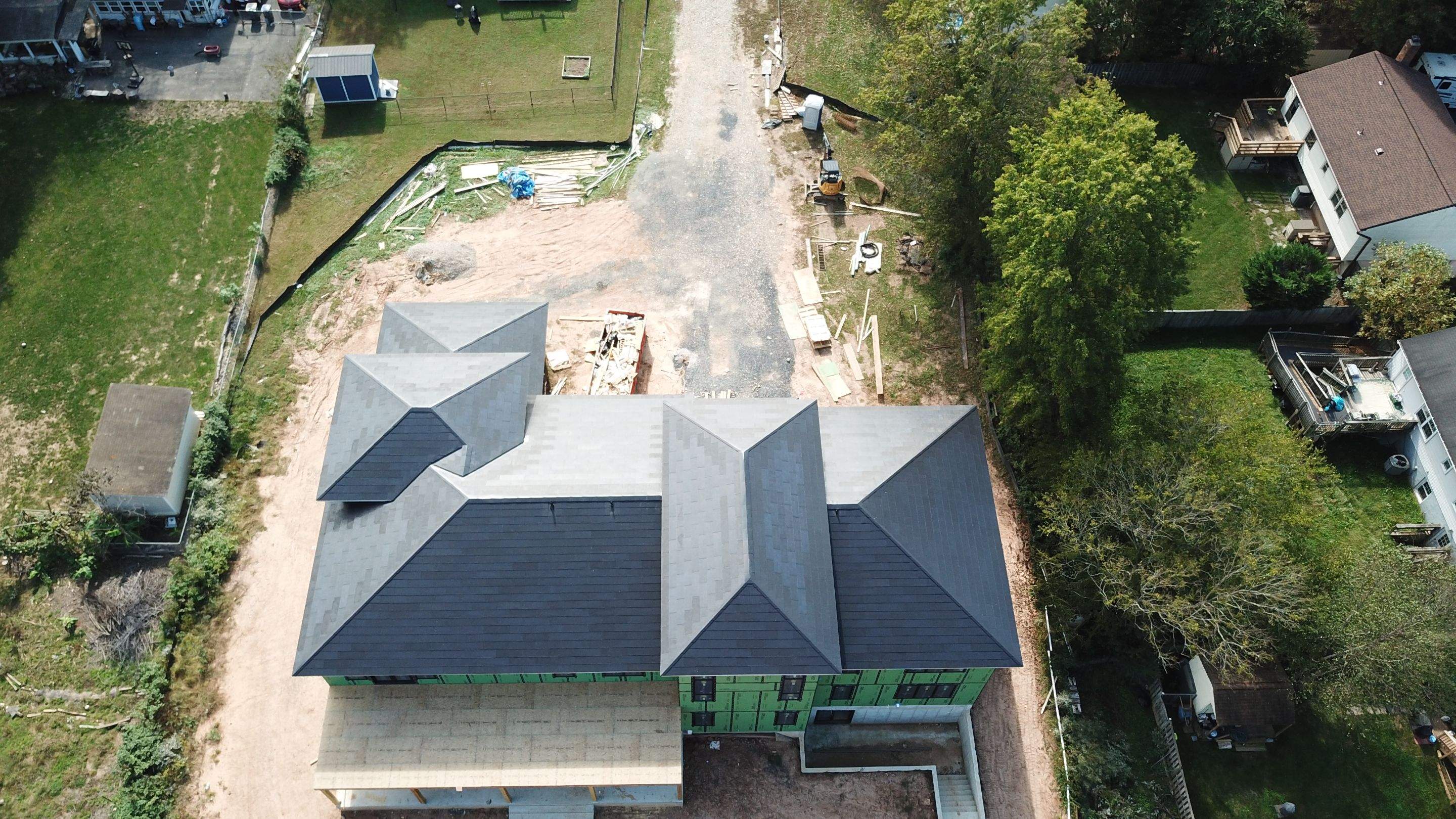 Tesla Solar Roof  using Tesla Solar Roof V3 tiles by American Home Contractors