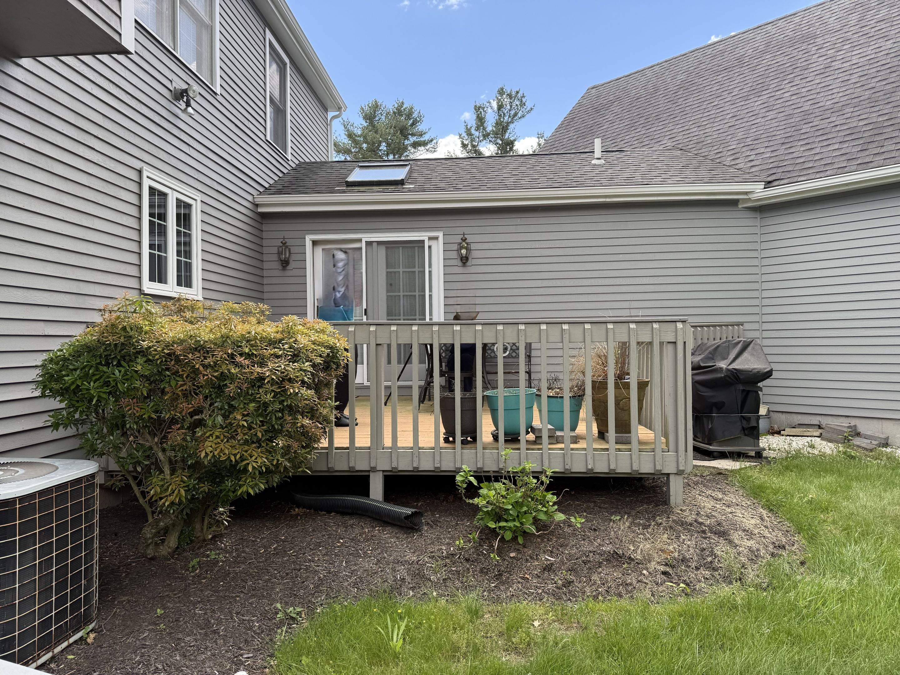 Replacement deck using Trex Tropical Island mist decking and matching cocktail railing. Enclosed with Lattice by DiGiorgi Roofing and Siding Inc