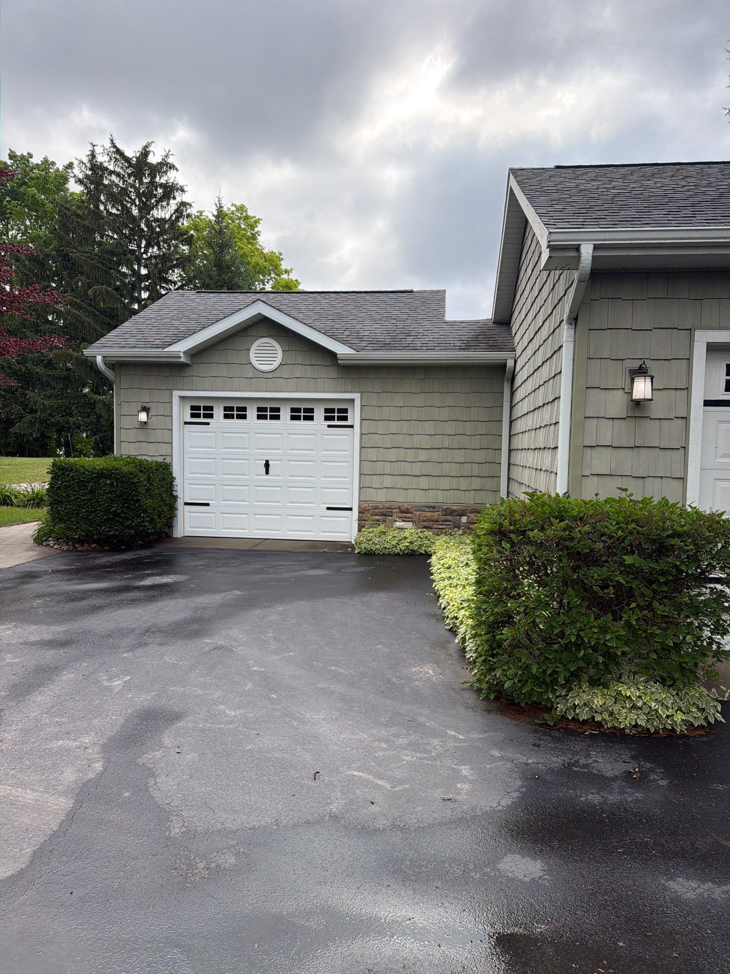 Gutter Helmet Protection System for Suttons Bay Home with Cedar Siding by Rainbow Seamless Systems