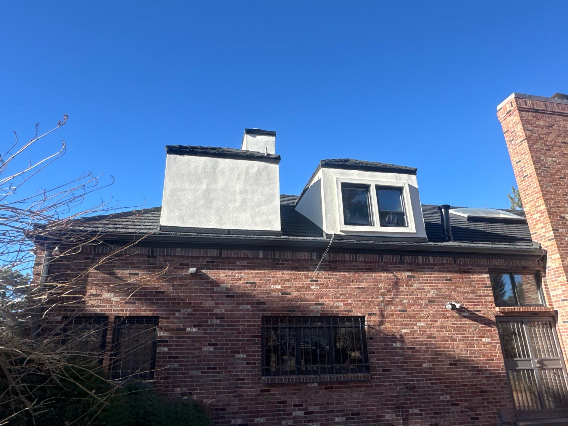 Unified Stone Coated Roof & Stucco Remodle by Blue Peaks Roofing LLC