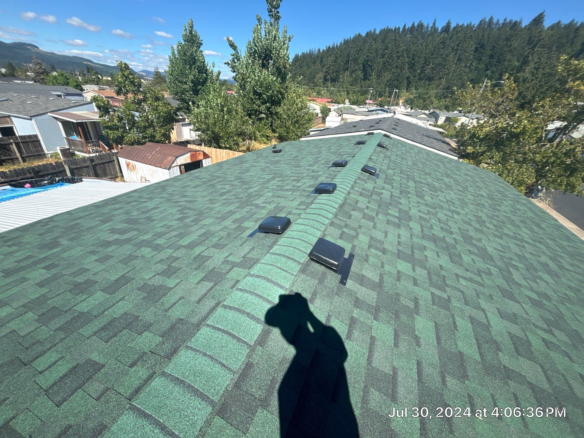 Residential Reroof using Owens Corning Duration Shingles in the color Chateau Green. by BEST Roofing & Waterproofing