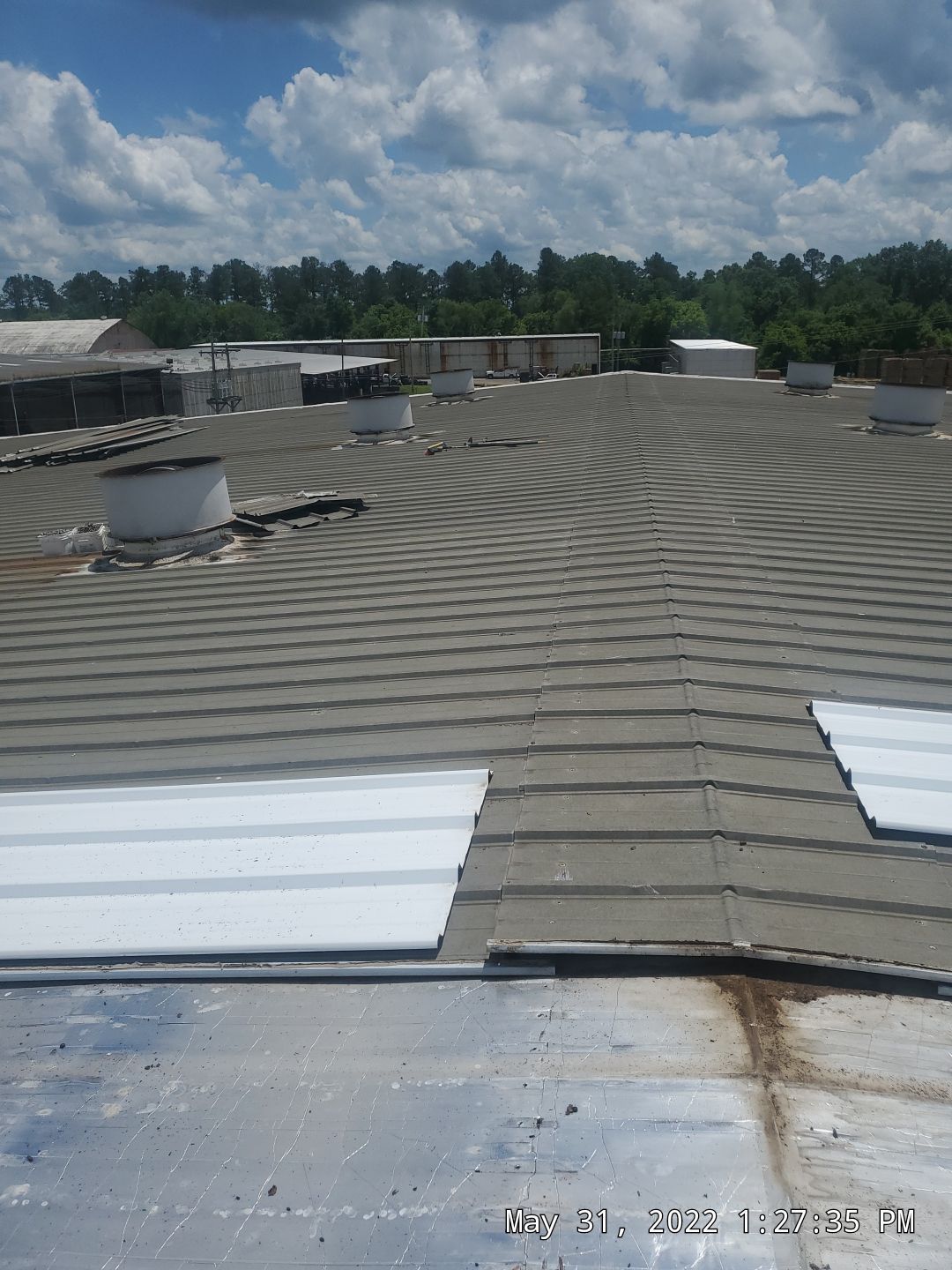 Commercial Roofing Installation using Aluminum Roofing panels by Hostetler Roofing
