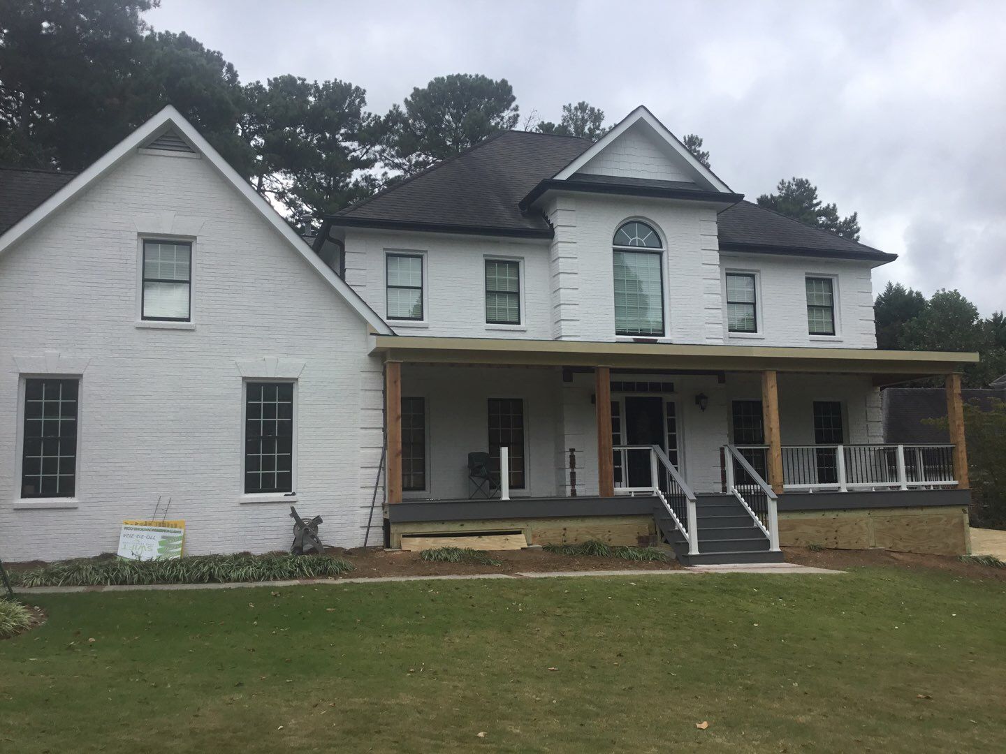 Custom Front Porch Construction with White Railing in Dunwoody by Swift Home Renovations