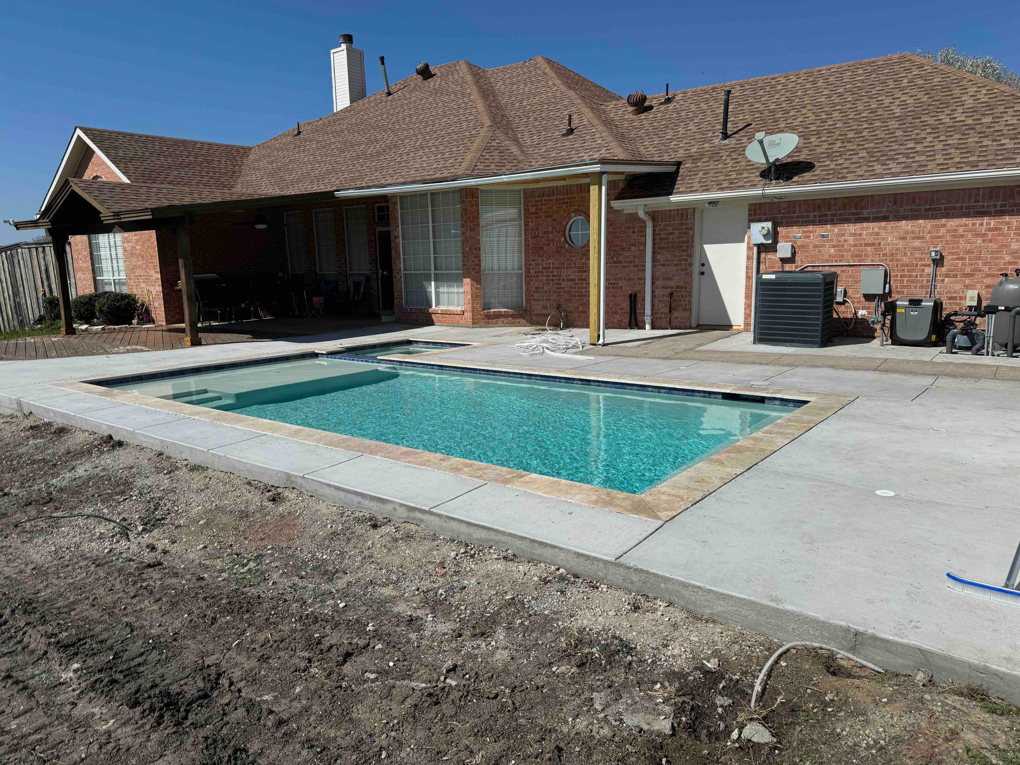 Geometric Pool with Raised Spa and Spillway by Pinnacle Pools and Spas - DFW