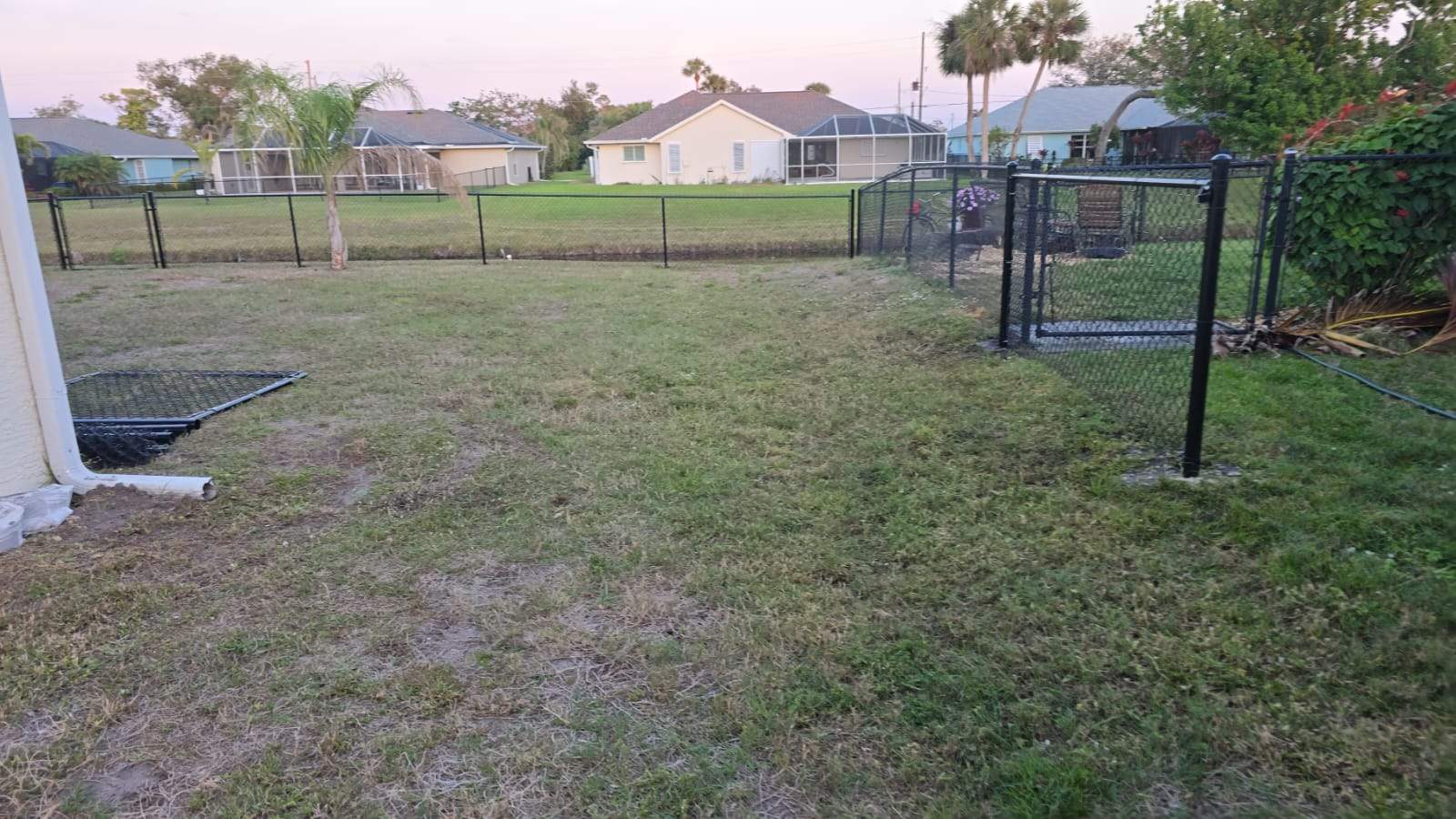 Waterfront Black Chain Link Fence Installation in Rotonda West by True Fence LLC