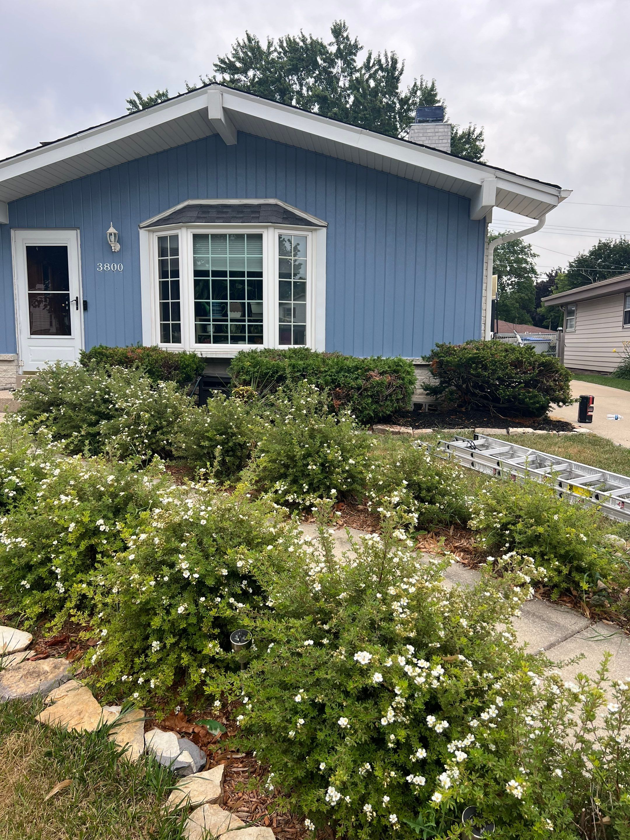 Blue Vertical Siding and Trim Installation in Milwaukee by OCS Contracting Services