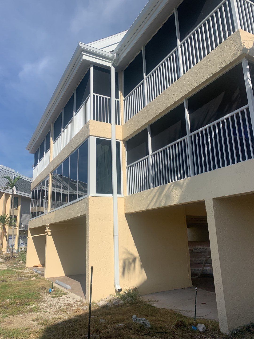 Commercial White Gutter Installation un Sanibel FL by Gutter Professors