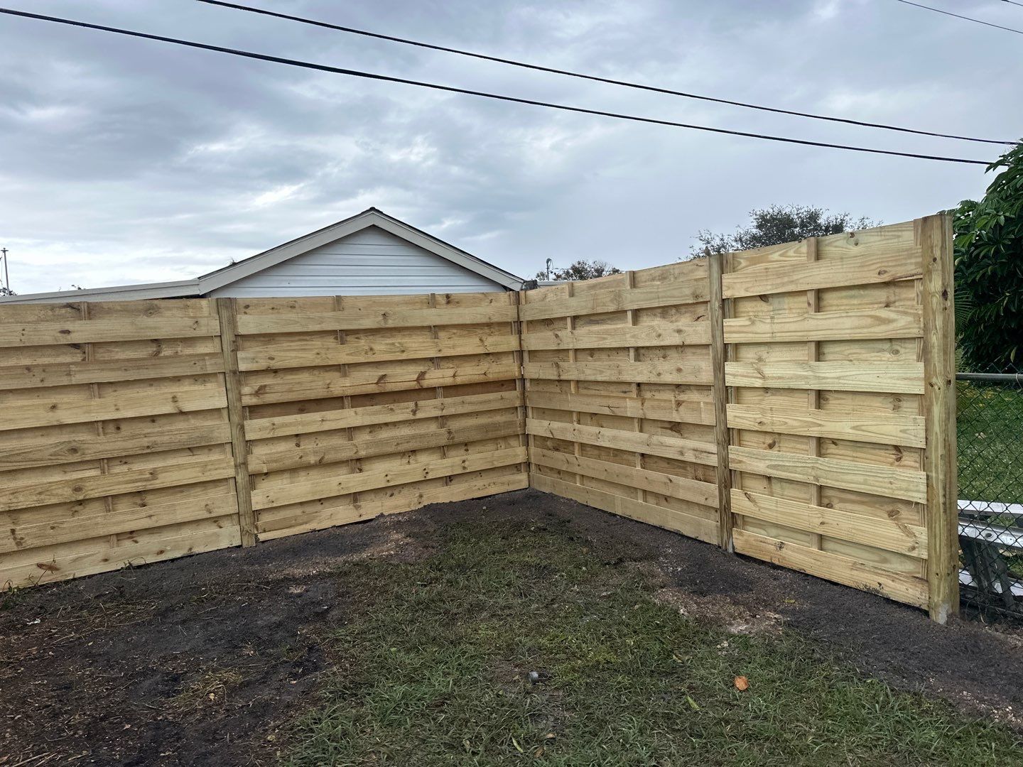 Wood Fence Installation using 6Ft Tall Pressure Treated Wood Privacy Fence by Asap fence and gates, LLC