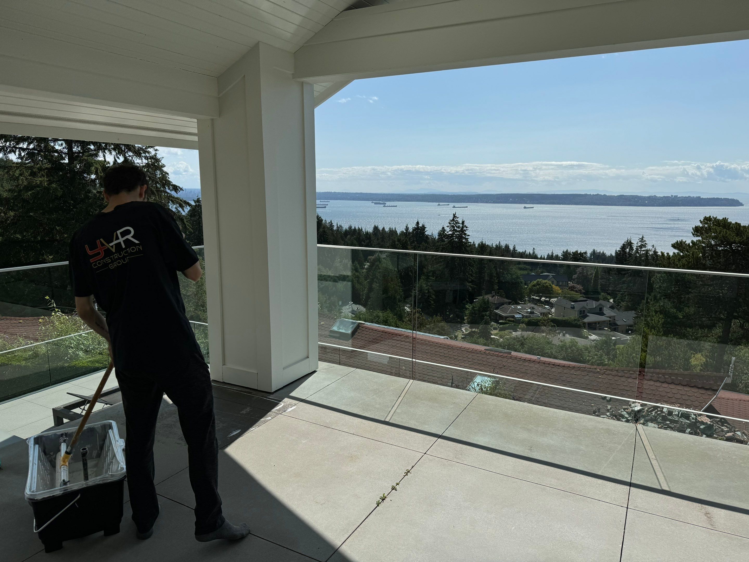Applying Concrete Sealer  by YVR Construction Group