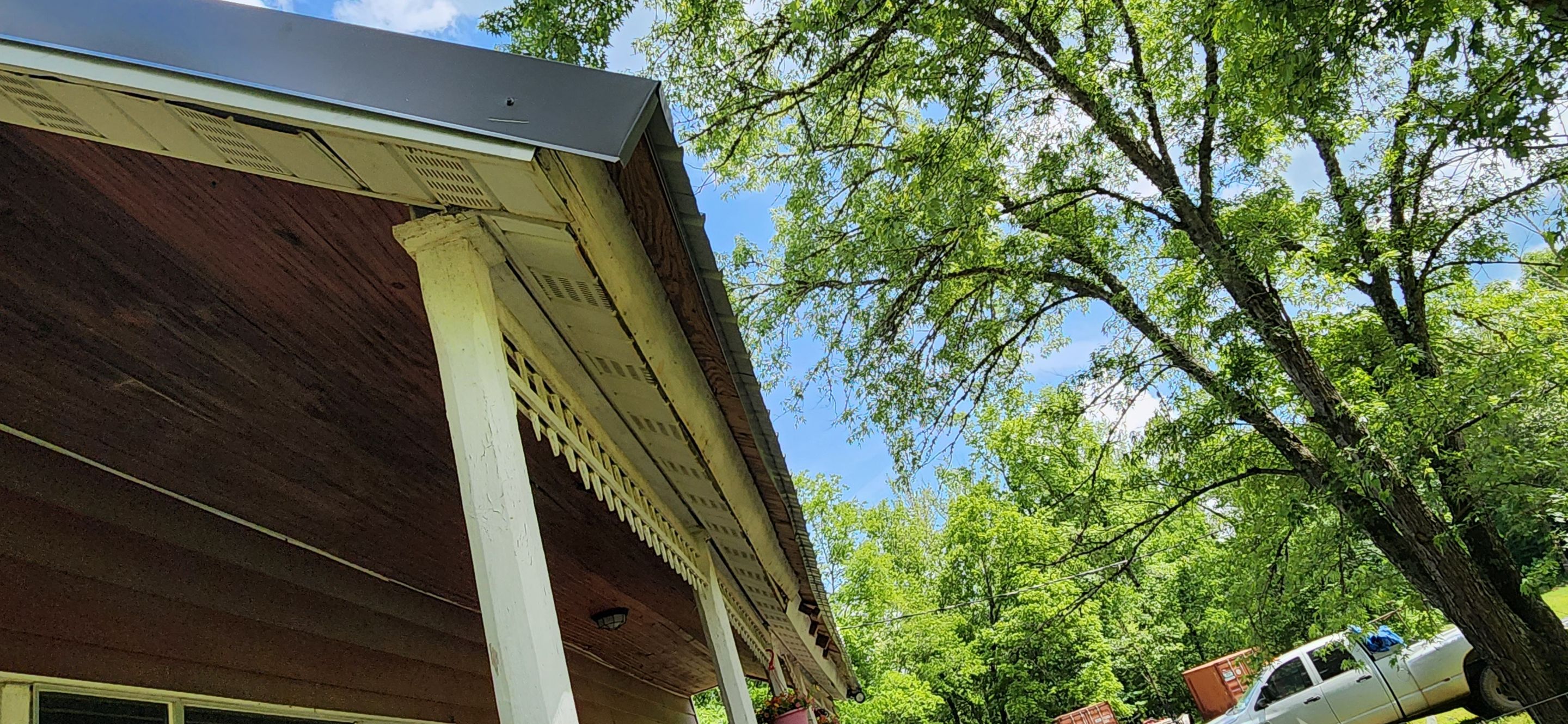 Residential Roofing Installation using 26 Gauge Colored Panels by Hostetler Roofing