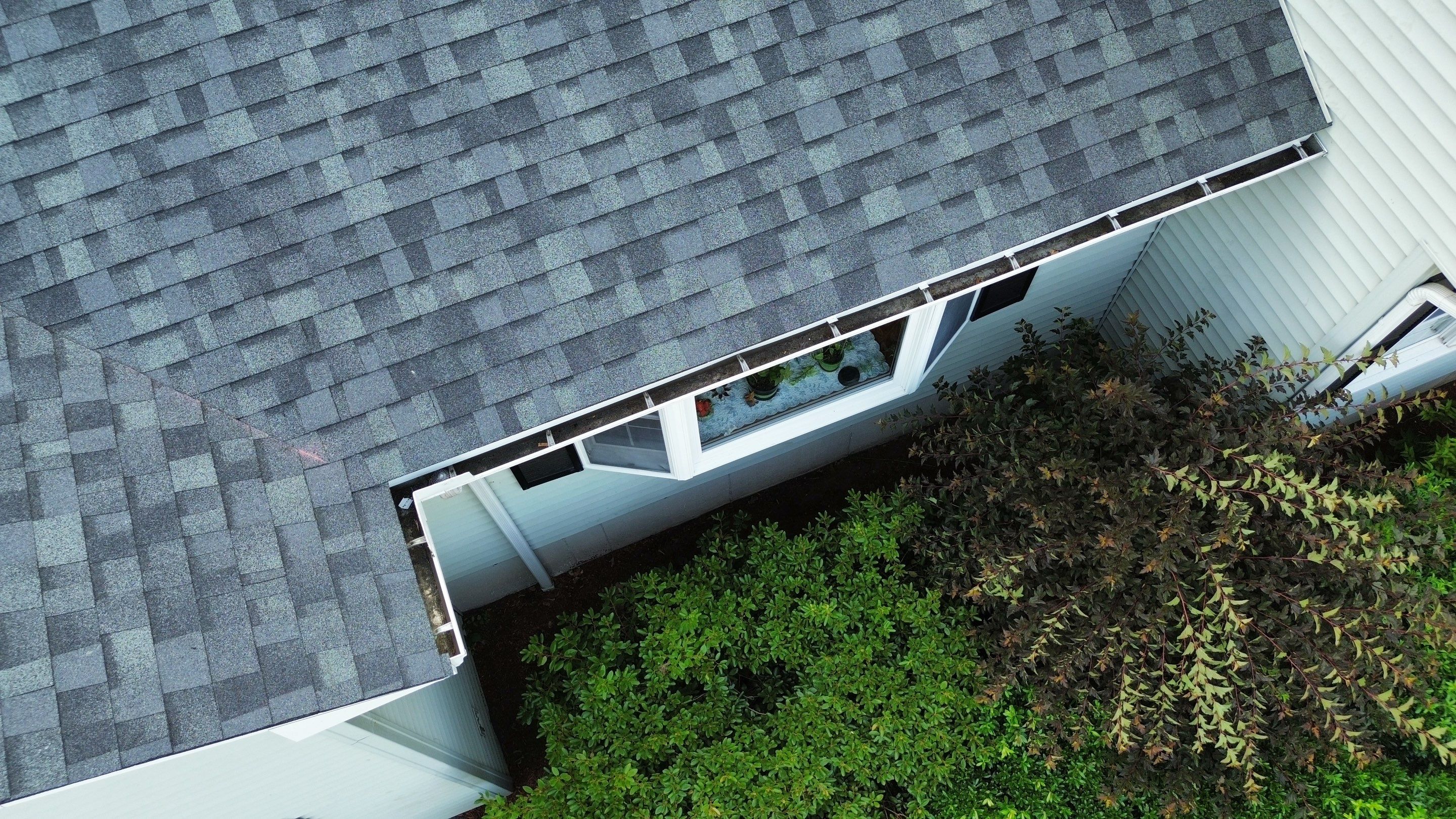 Complete Roof Replacement with Chimney Flashing, Gutter Guard System, and Vinyl Siding Repairs by Mighty Dog Roofing of Greater Middlesex County